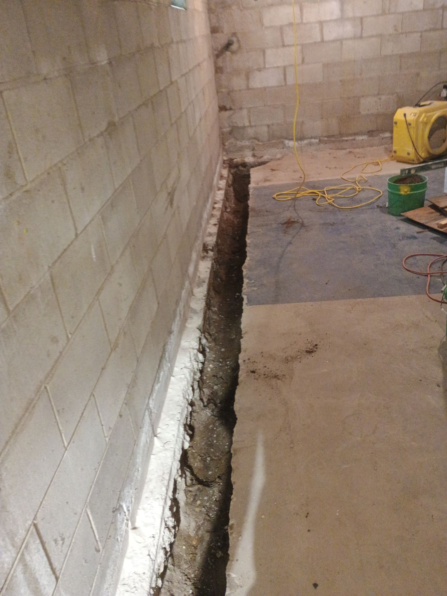 Interior Drain Tile & Buried Discharge in South Minneapolis by Waterproofing Northeast