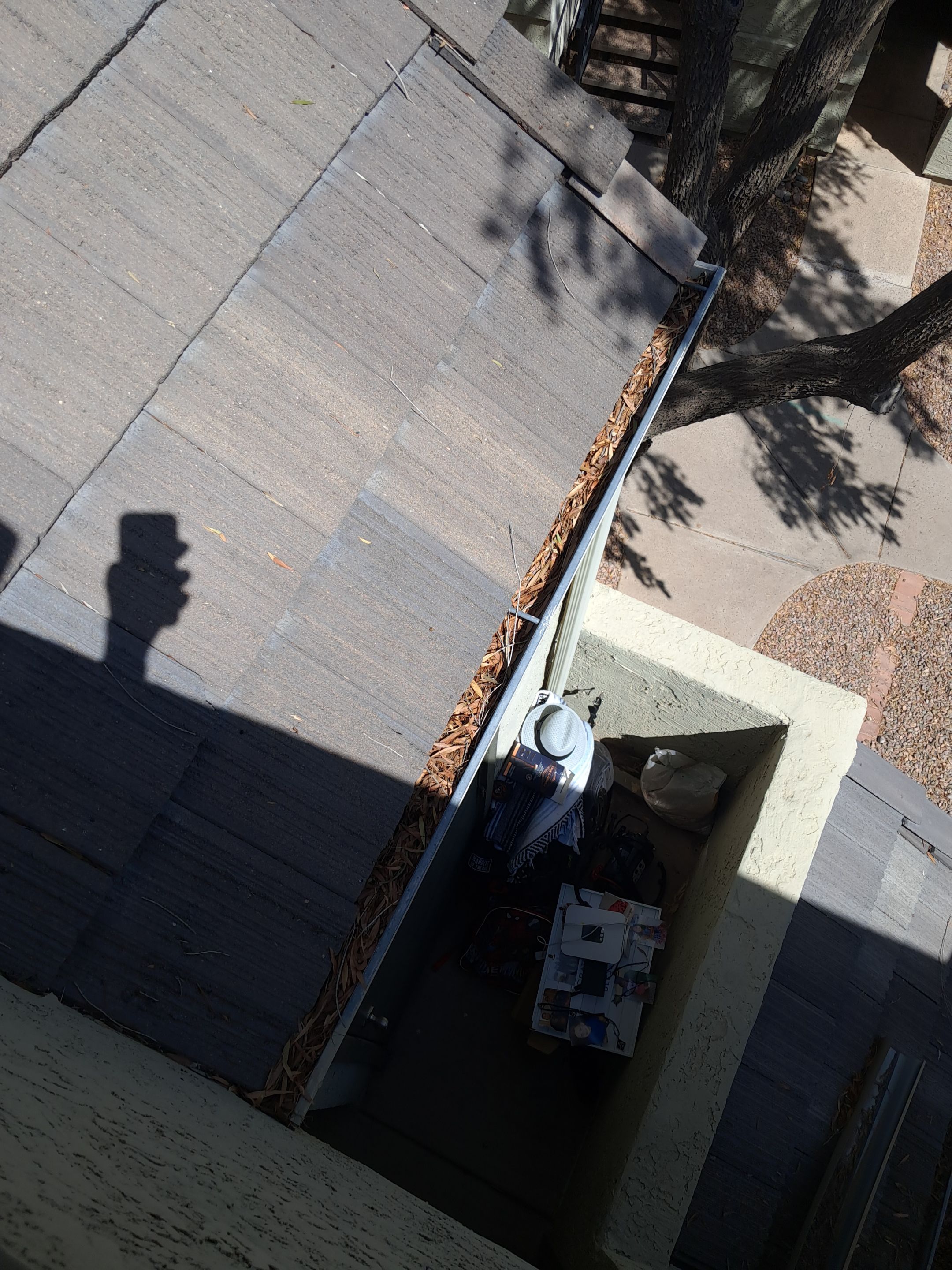 Commercial gutter cleaning Mesa & Gilbert & Chandler, AZ before photo with filled gutters