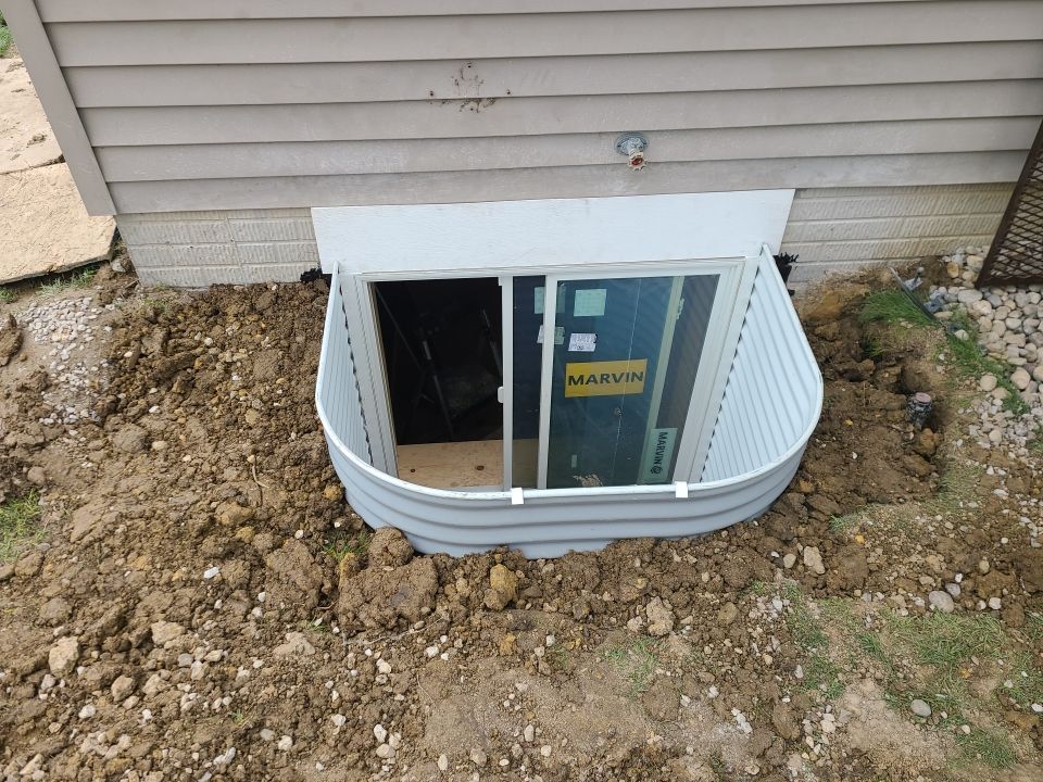 While Steel Egress Window Installation by Toledo Basement Repair