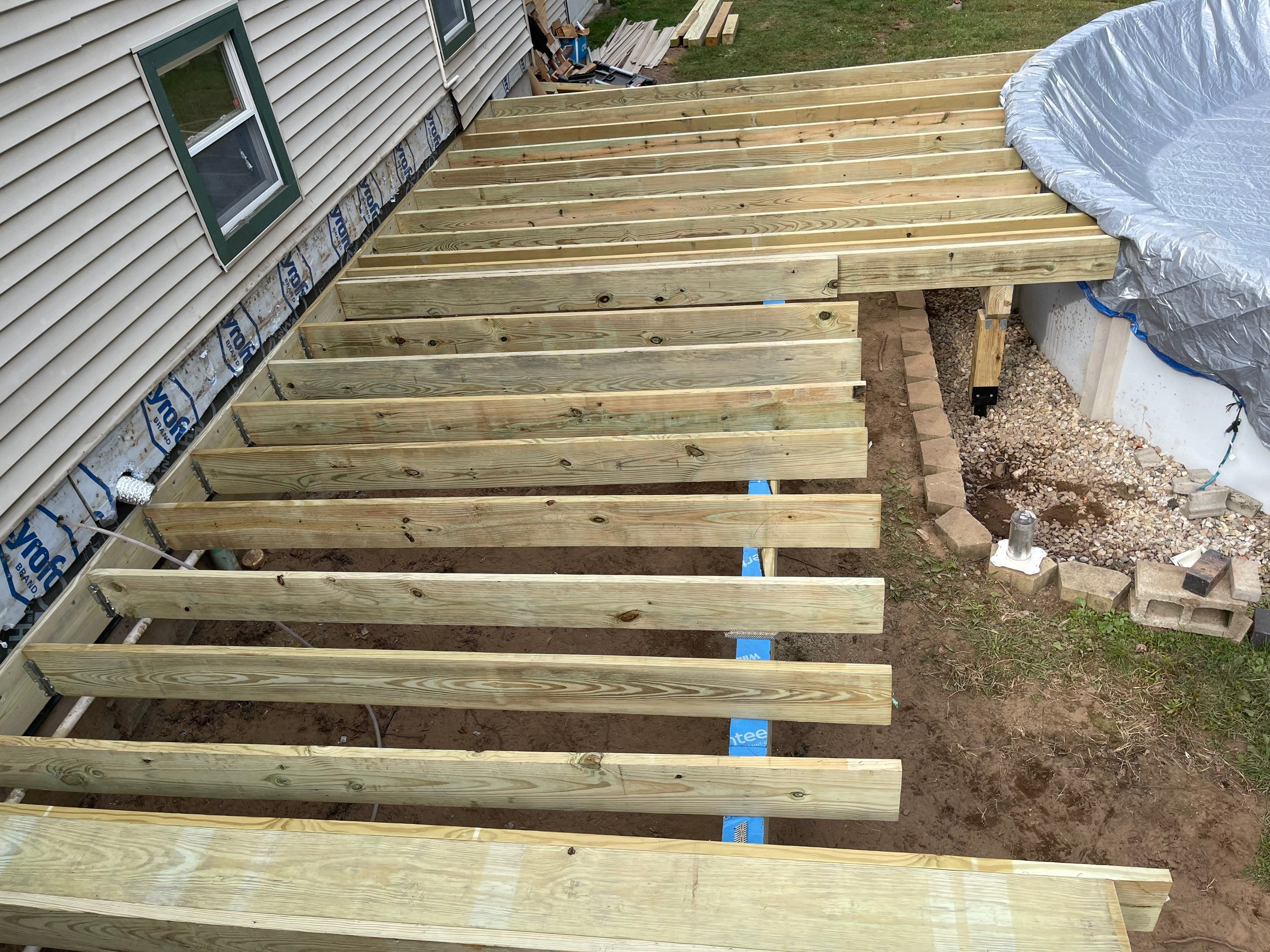 Replacement pool deck with Trex Lineage Carmel and Transcend railings by DiGiorgi Roofing and Siding Inc