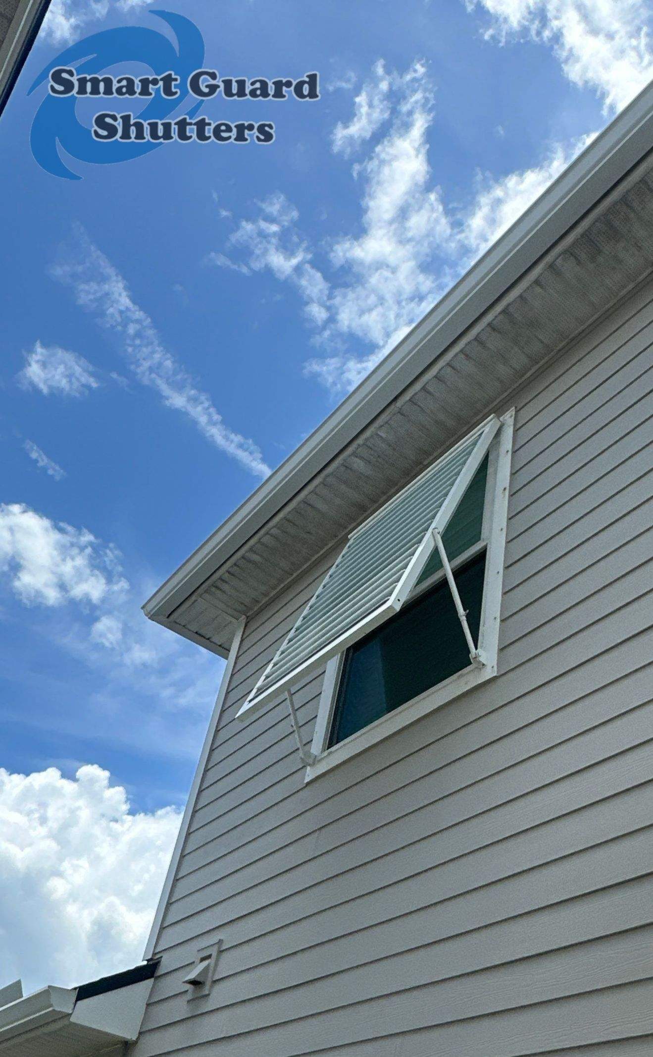 Impact Bahama Shutters in Signal White by Smart Guard Shutters