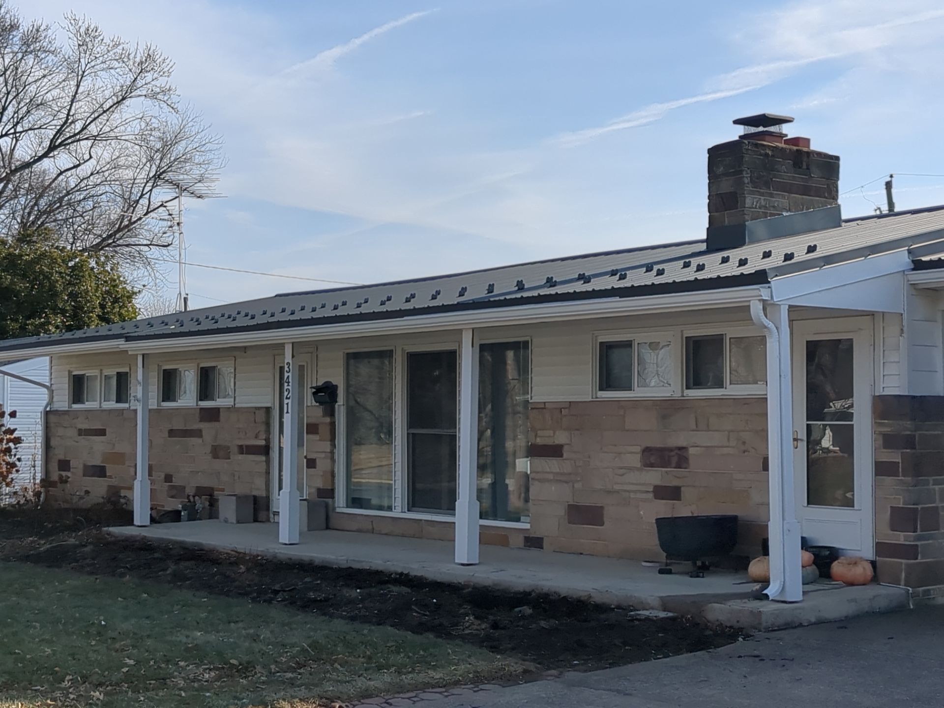 Metal Roofing Installation and Stone Veneer Exterior Refresh in Camp Hill by Esh Builders