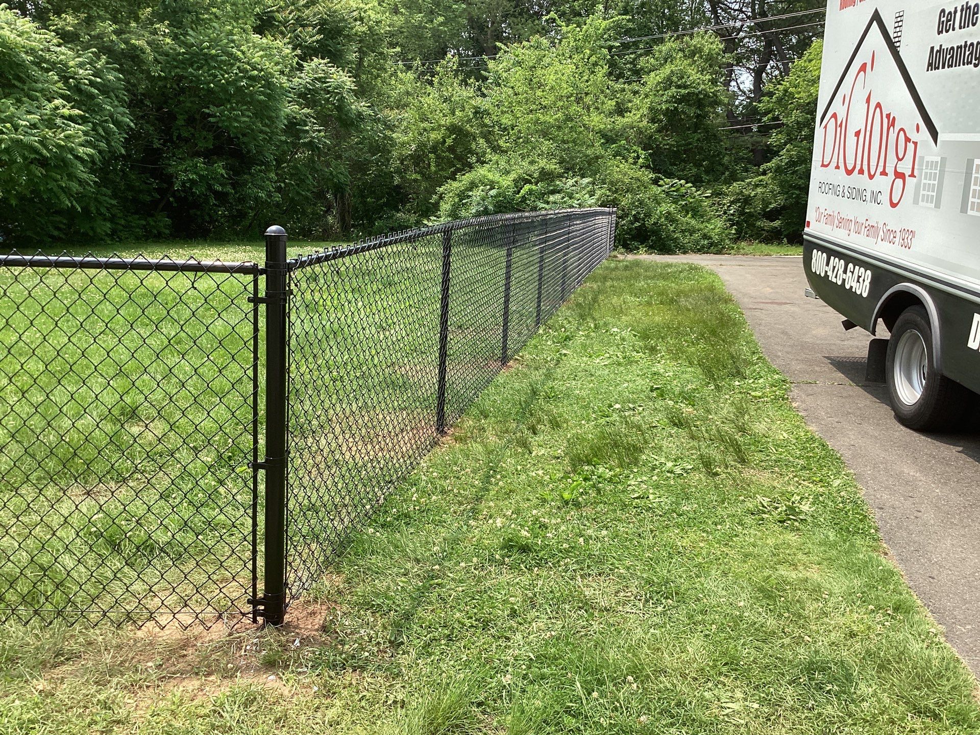 New Black Chain link fence with matching gates  by DiGiorgi Roofing and Siding Inc