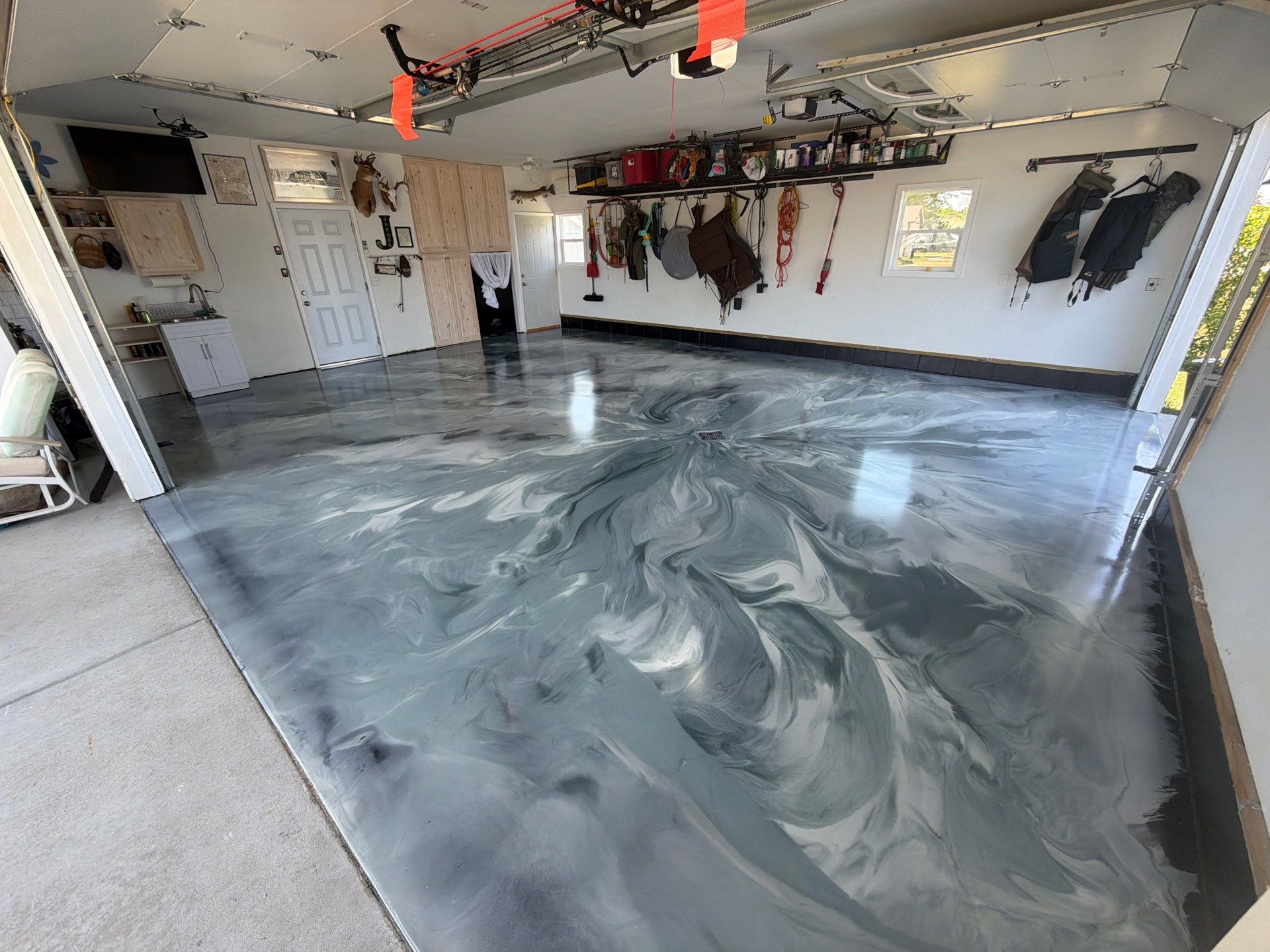Custom Metallic Epoxy Floor and Polished Countertop Installation in Mears by Gordon Painting