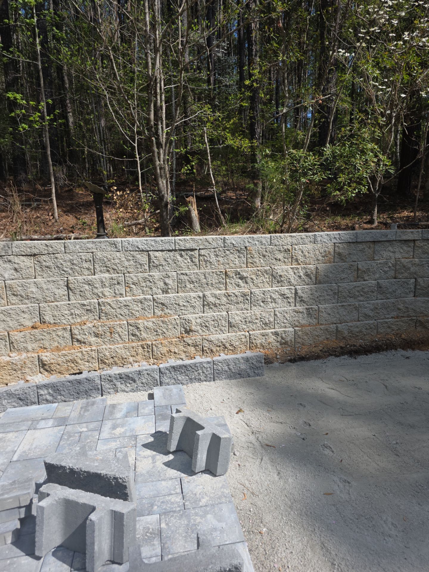 Pittsboro Outdoor Living Transformation – Retaining Wall, Paver Patio & Elevated Deck by Elite Remodeling and Design LLC