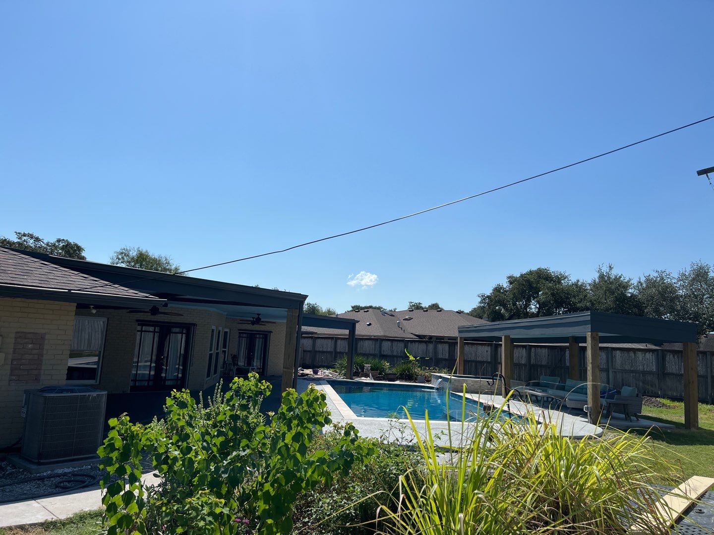 Beautiful pool side build by Bayfront Roofing and Construction