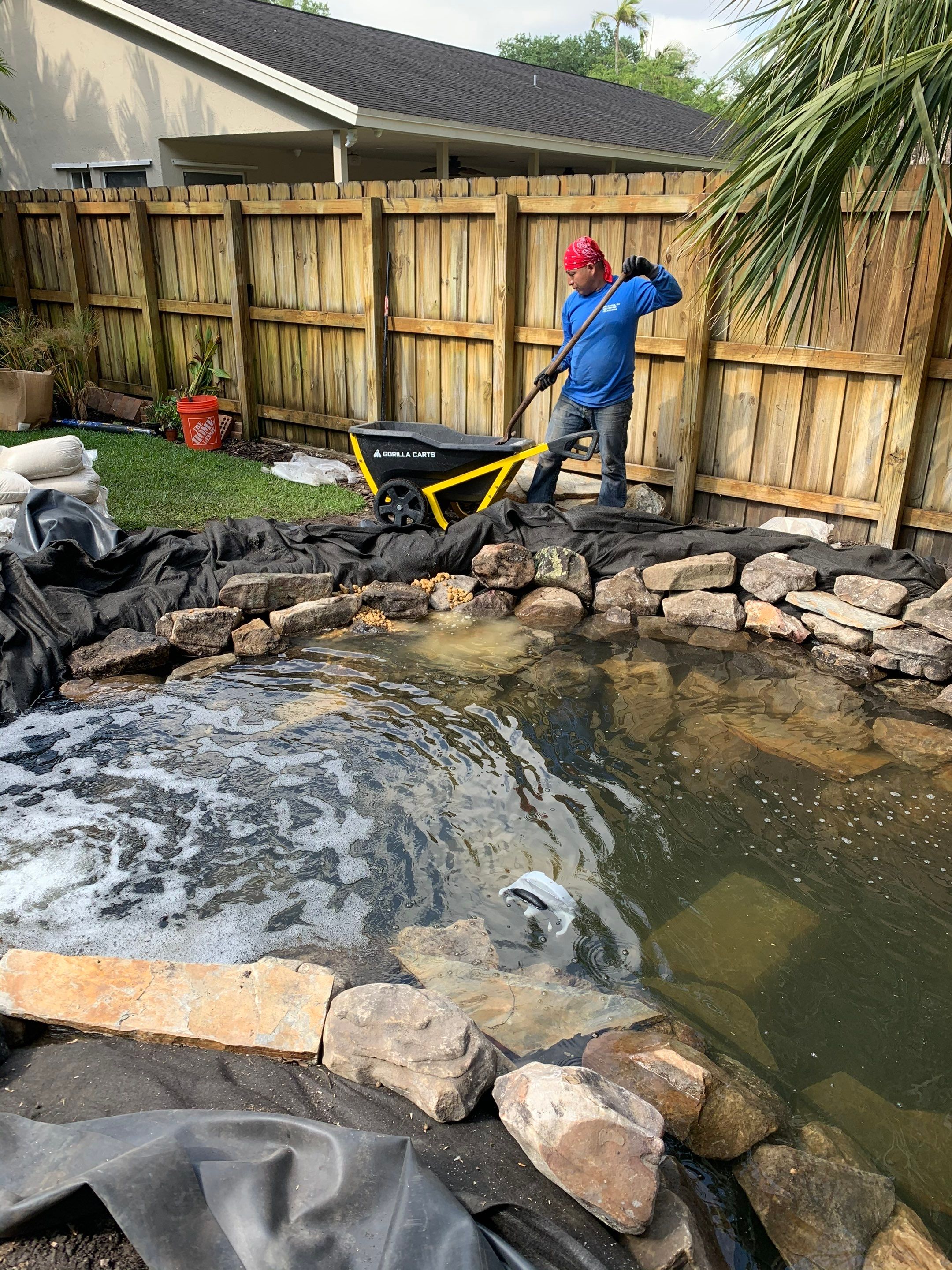 Small Koi Pond by Nature's Dream Landscape and Tree Service