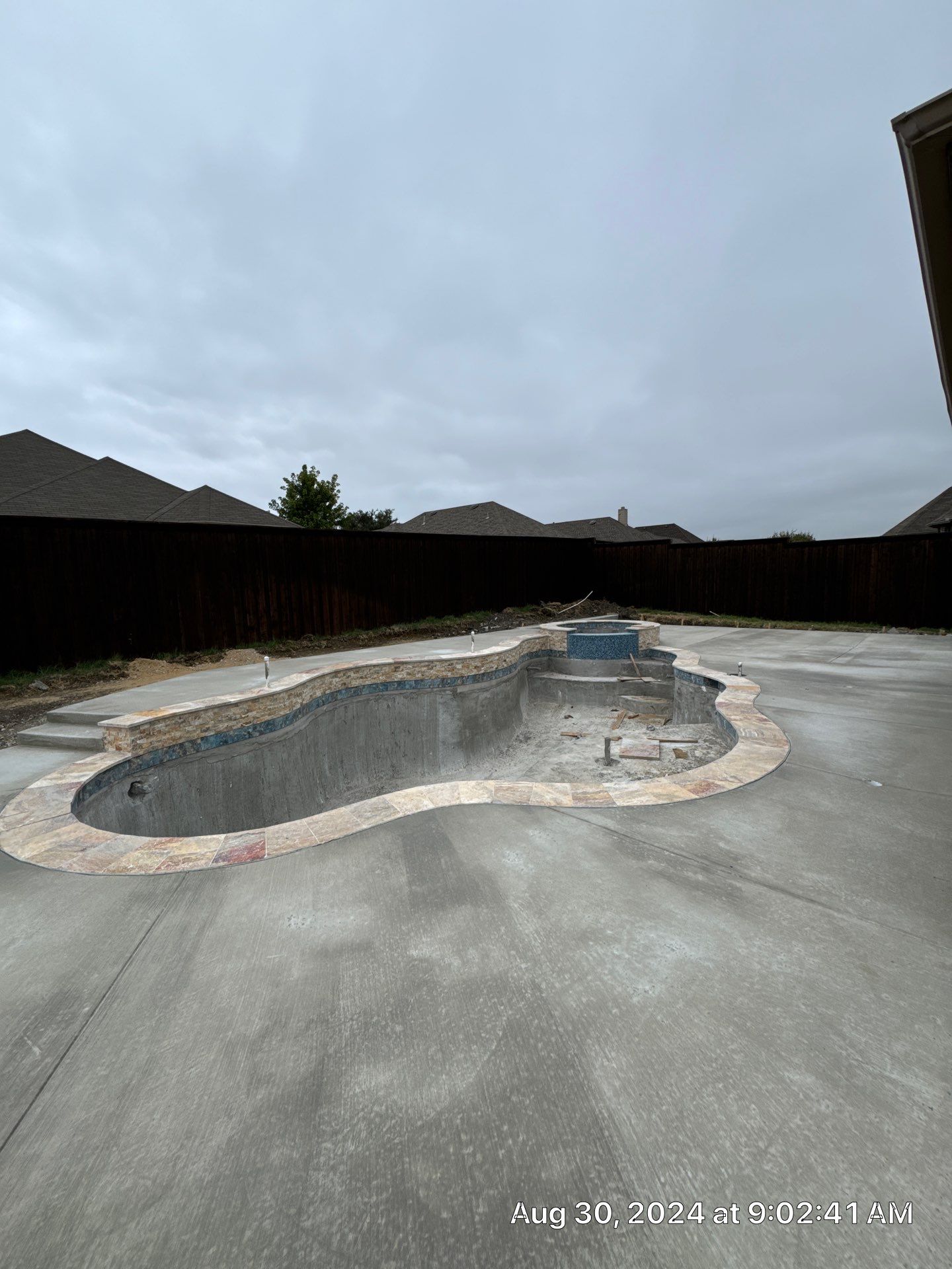 Freeform Pool with Raised Stone Spa by Pinnacle Pools and Spas - DFW