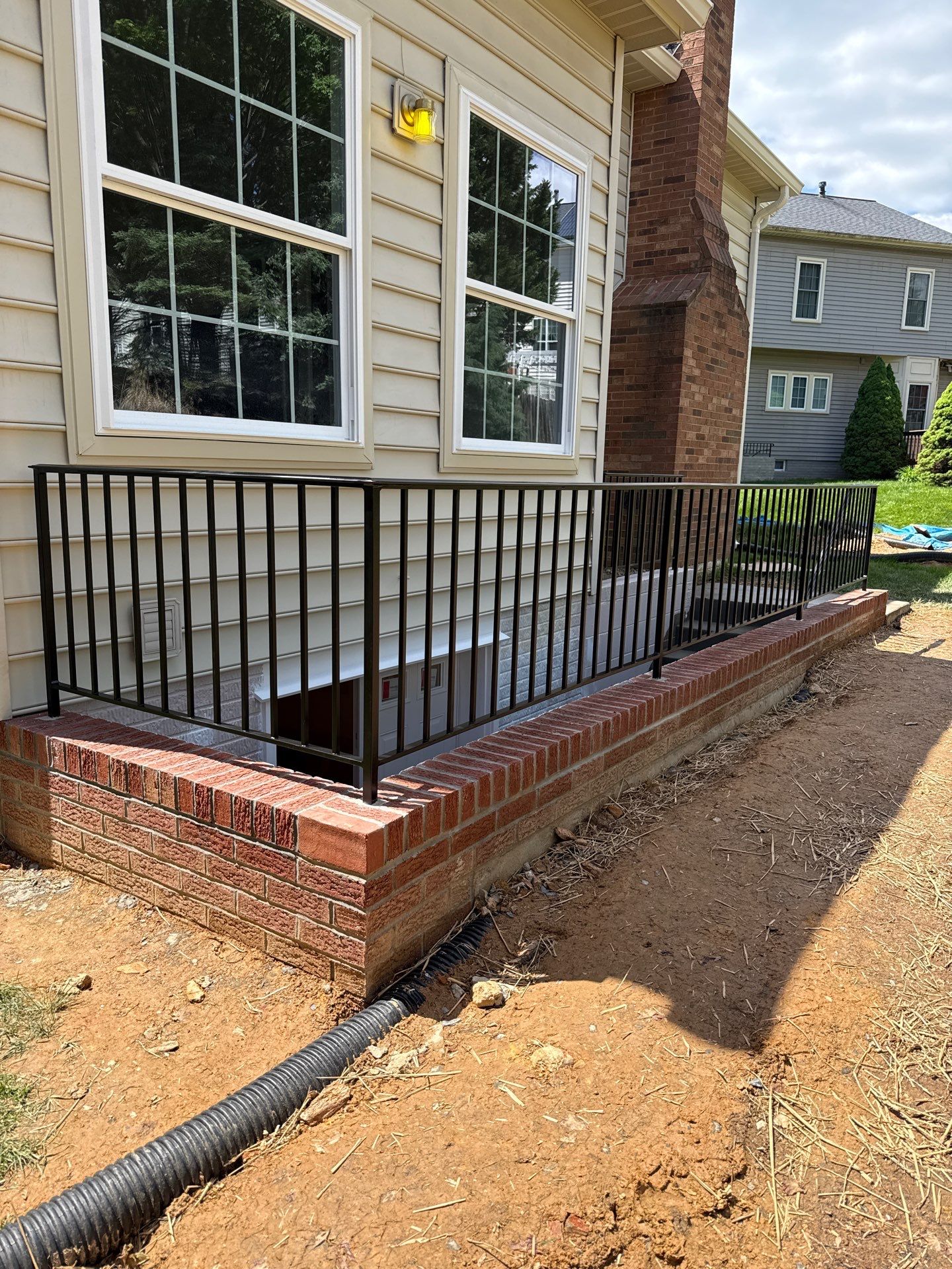 Basement Stairwell and Window Well Railing Installation in Germantown by Capitol Iron Works