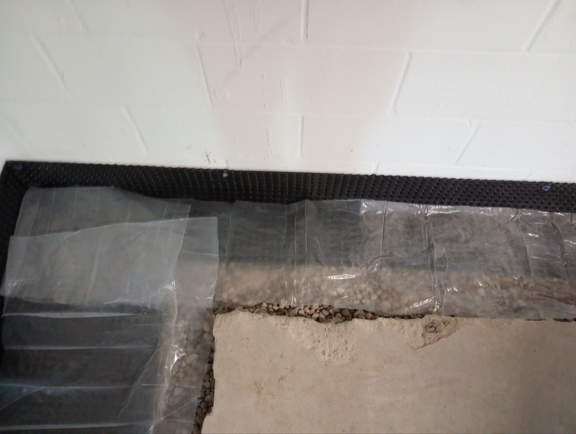 Correcting an Improper Installation for Alan in Chanhassen by Waterproofing Northeast