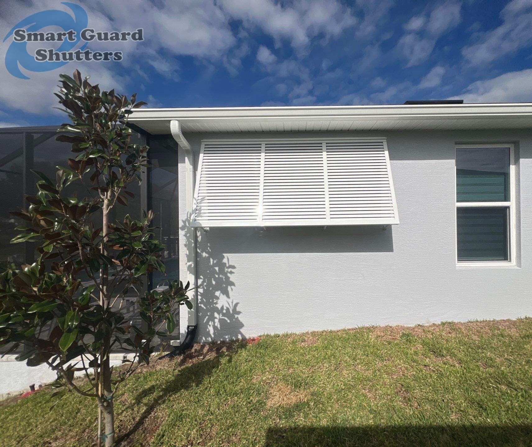 Decorative Bahamas in Signal White by Smart Guard Shutters