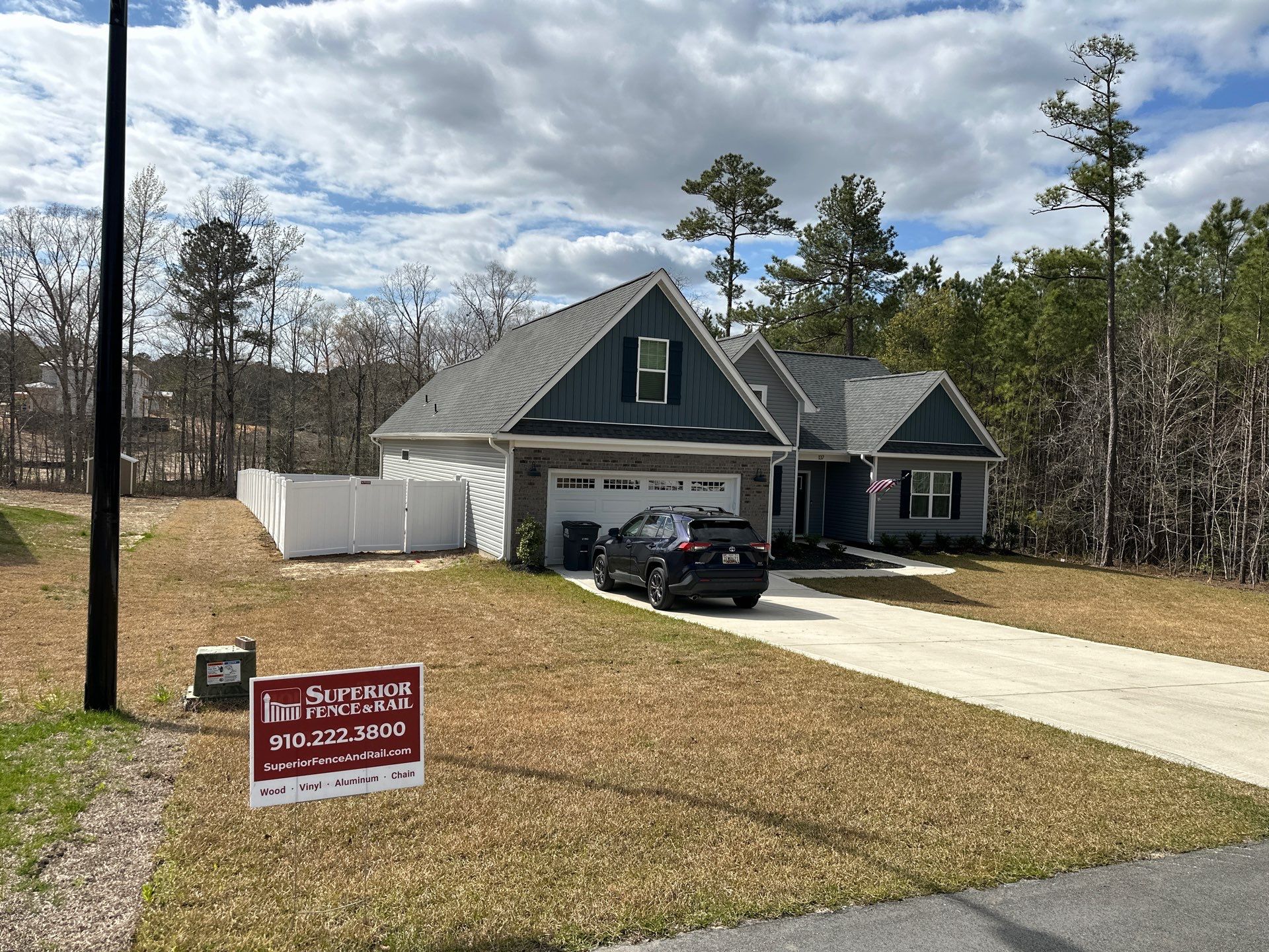 White Vinyl Privacy Fence Installation in Cameron, NC by Superior Fence and Rail