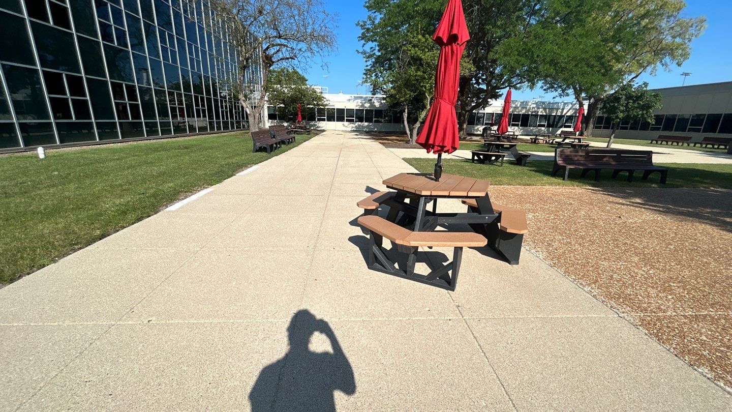 concrete using Algaecide, soft wash soap by Northern Power Washing LLC.