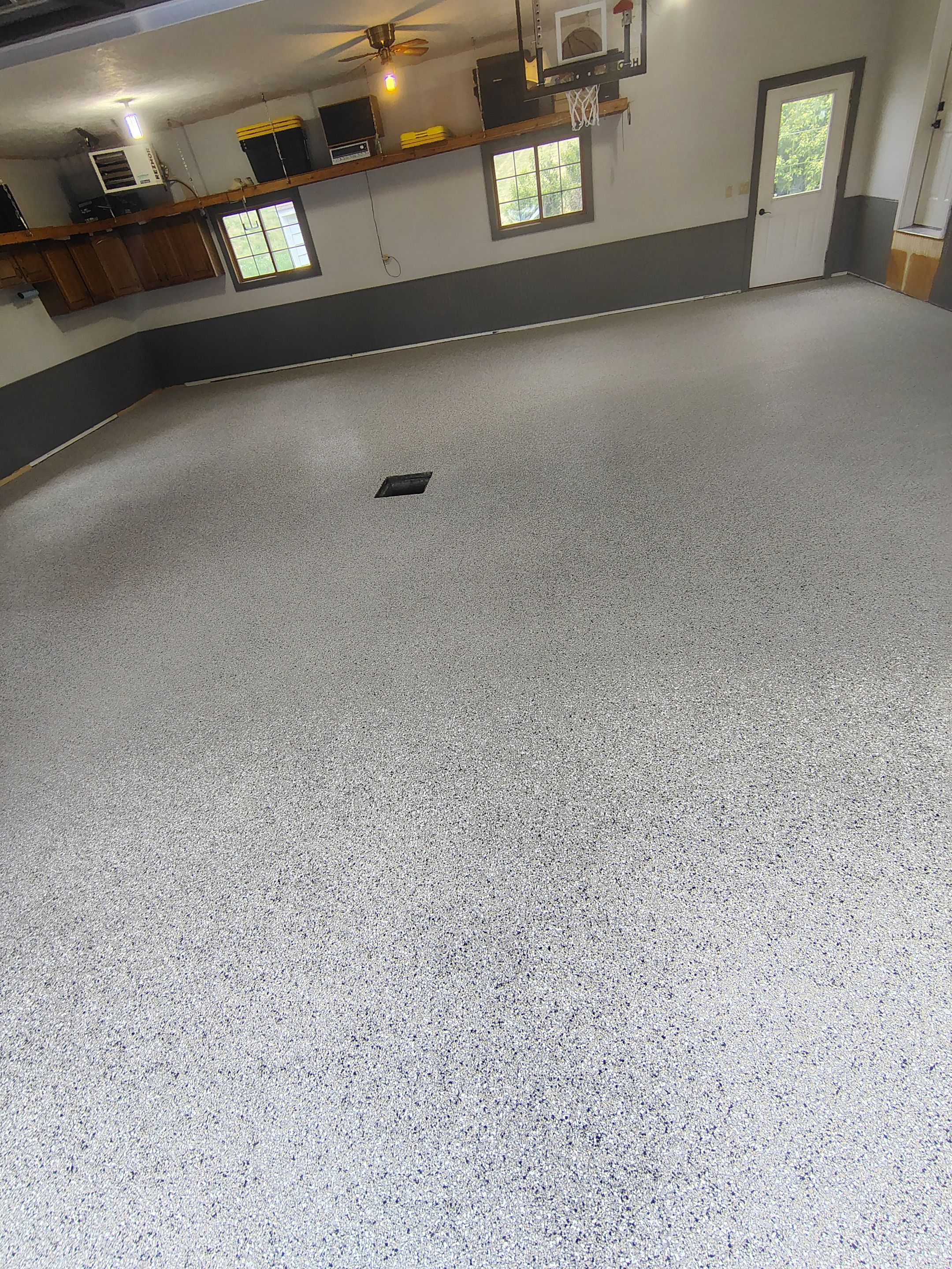Multi-Fleck Epoxy Garage Floor Coating in Dell Rapids by Select Painting, Coatings & Garage Cabinets