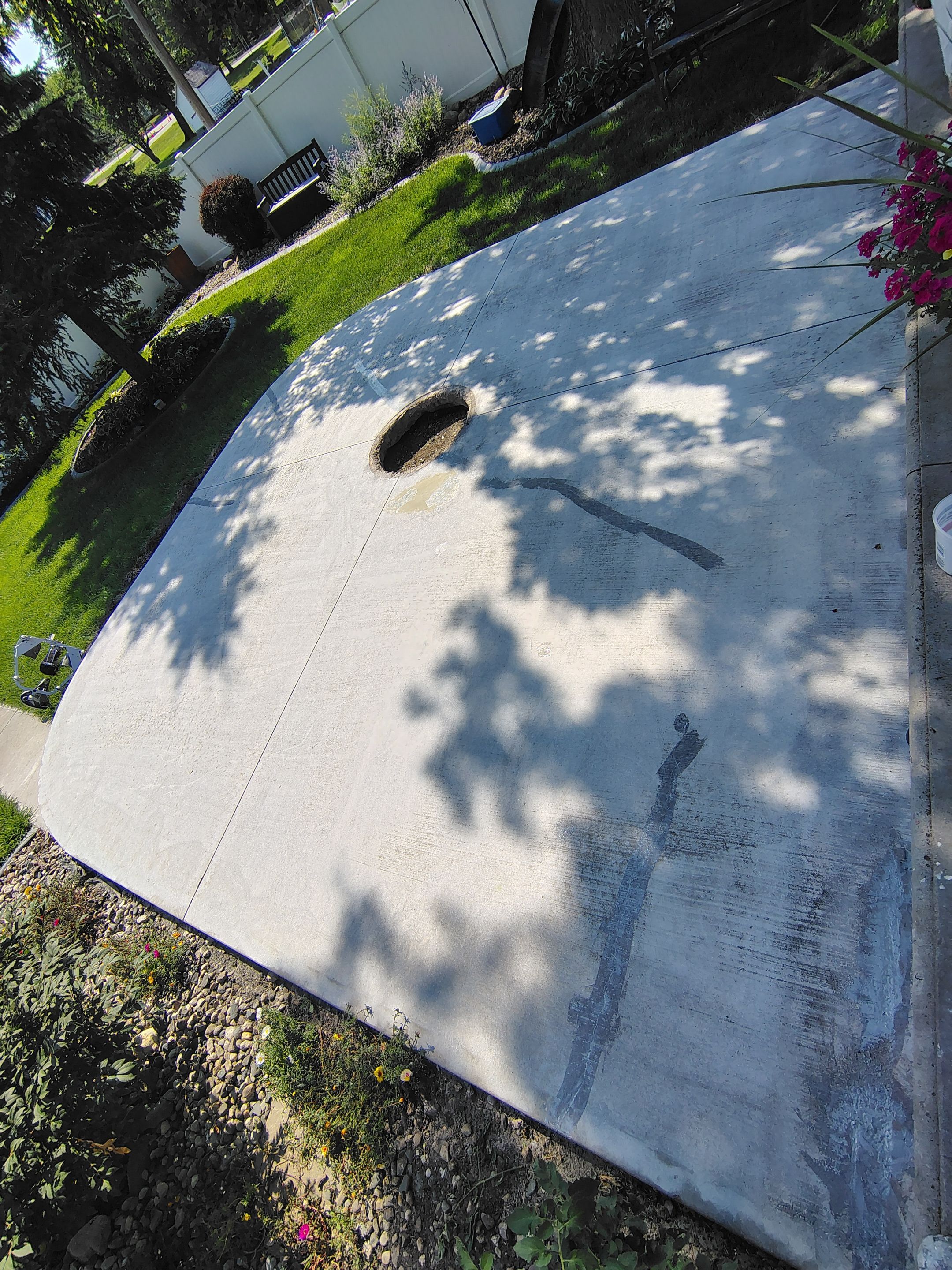 Custom Garage Floor Coating and Backyard Patio Refinishing in Tyndall by Select Painting, Coatings & Garage Cabinets
