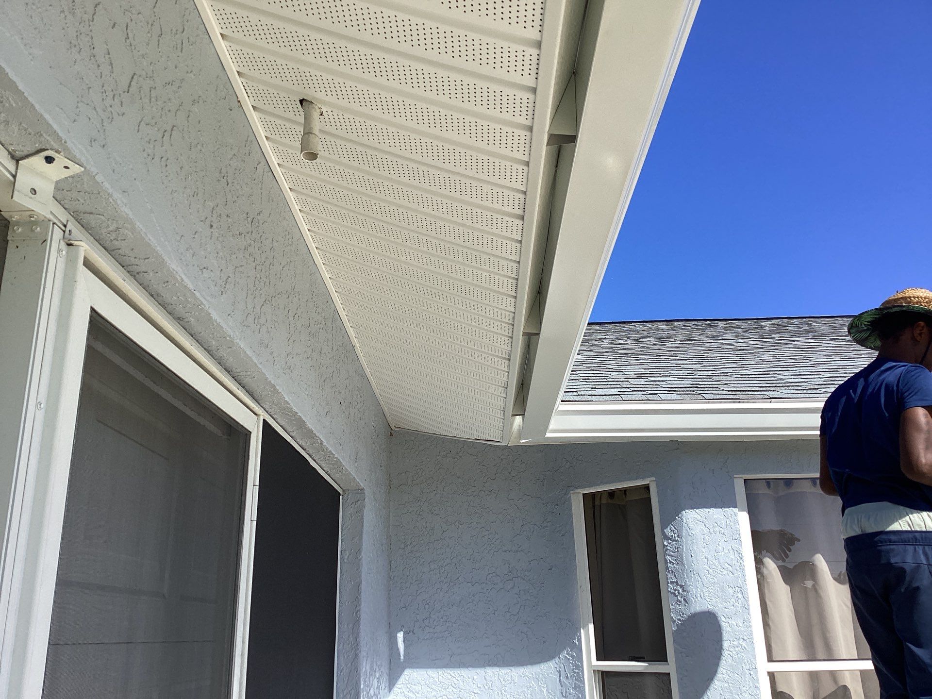 New White Seamless Gutters with Downspouts and Splash Guards in Cape Coral FL by Gutter Professors