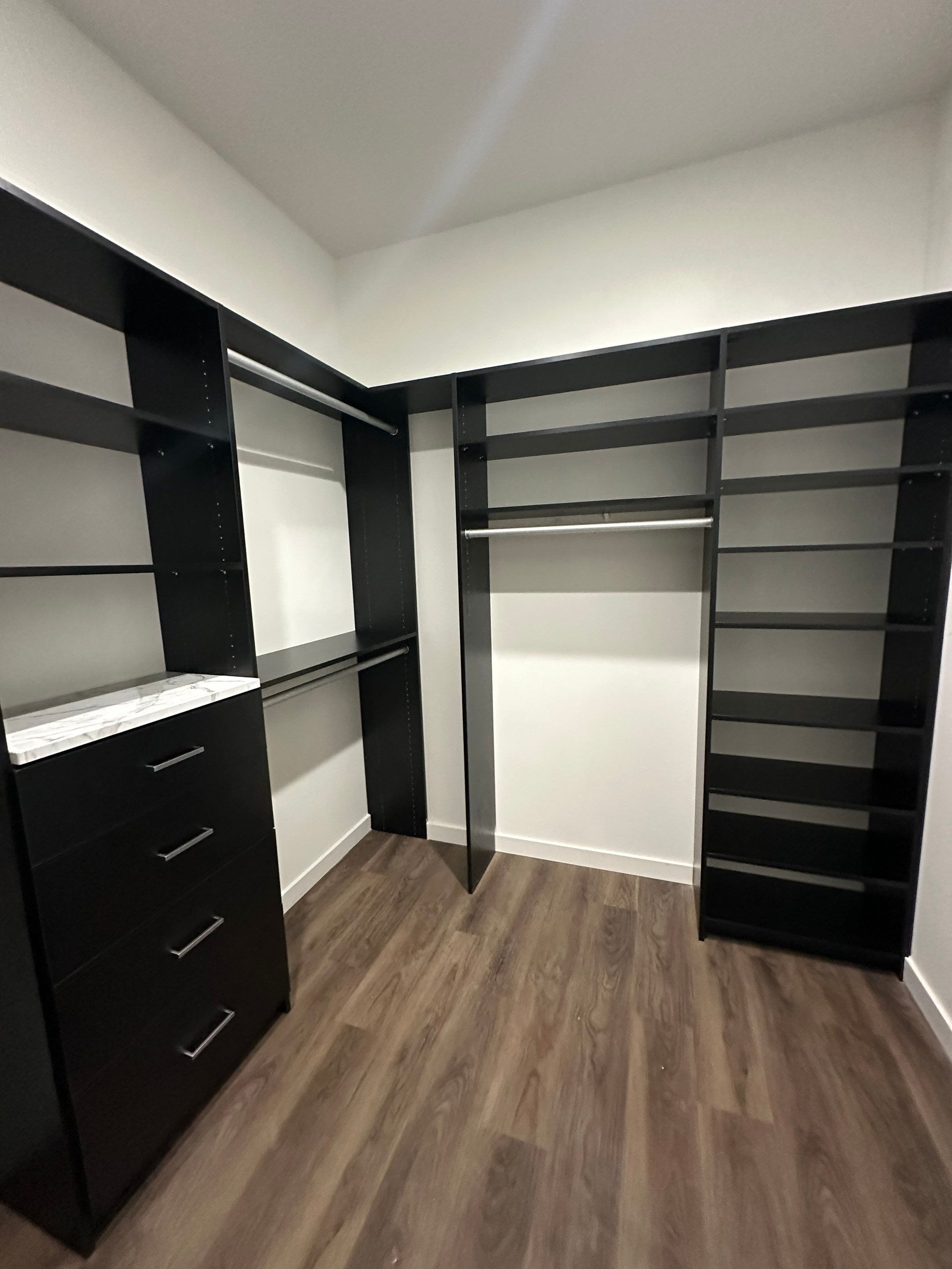 Custom Black Laminate Walk-In Closet Installation in Tampa by Square 1 Garage and Closet Solutions