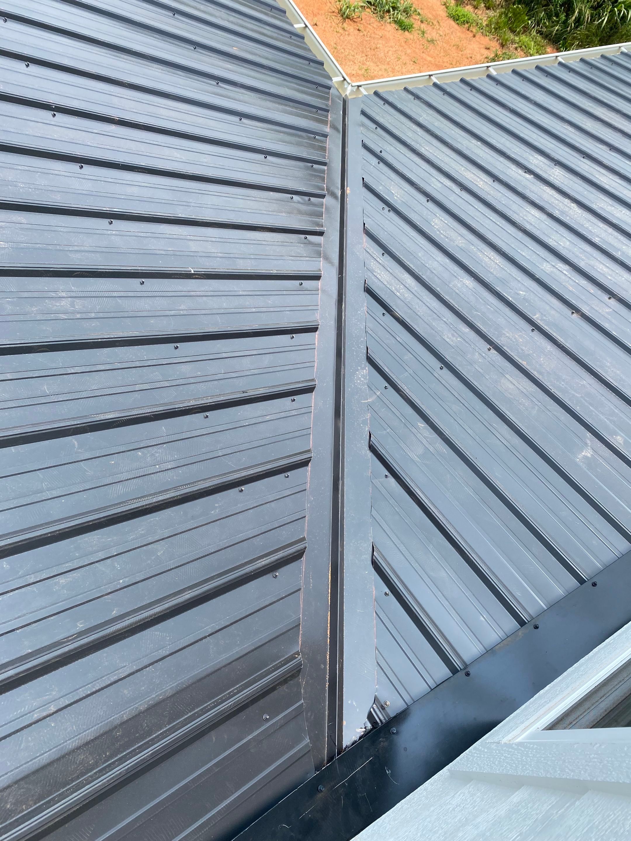 Jason's metal porch roof by BROCK BUILDERS 