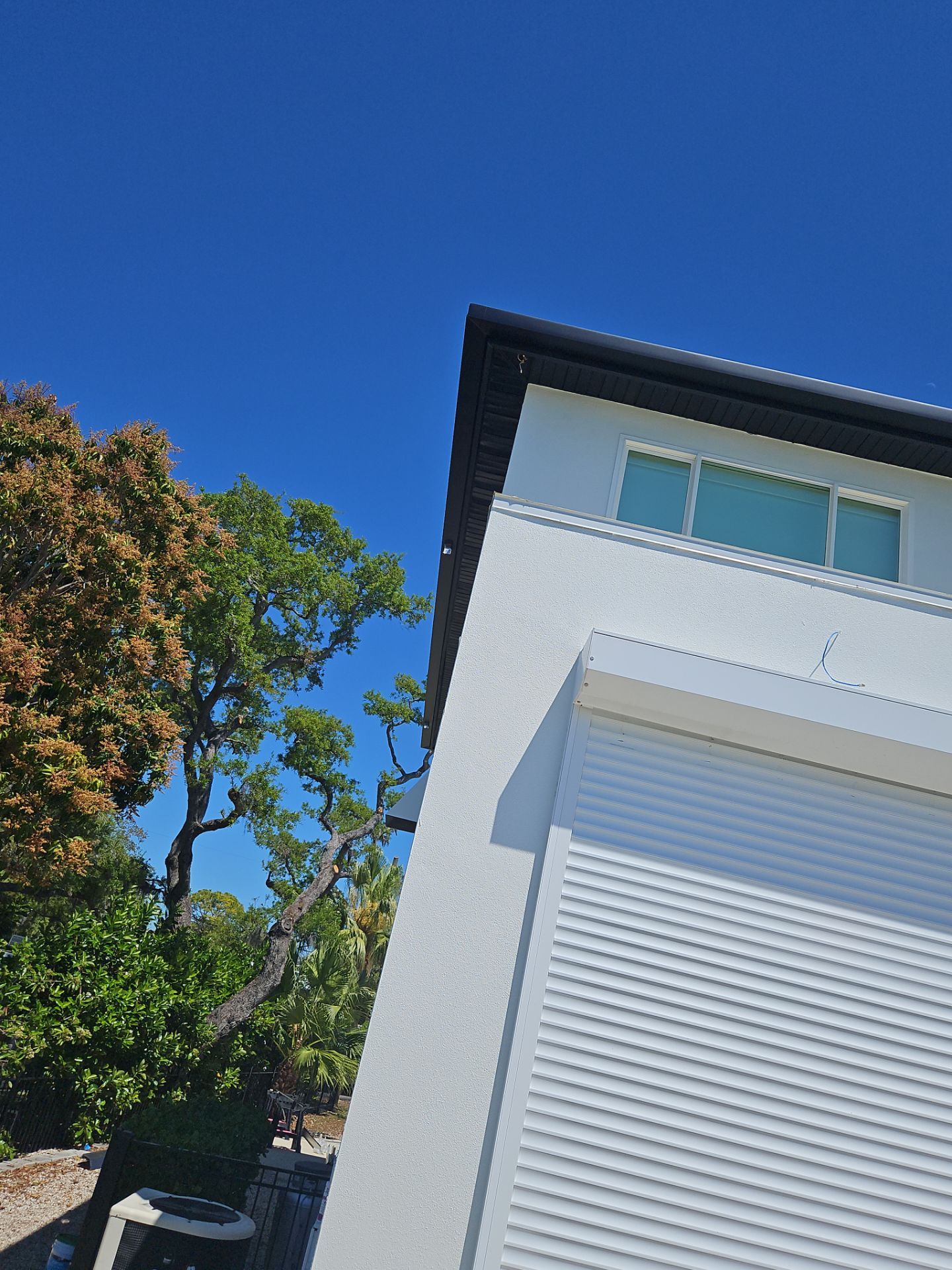 Soffit and Fascia Installation and black seamless gutters in Sarasota FL by Gutter Professors