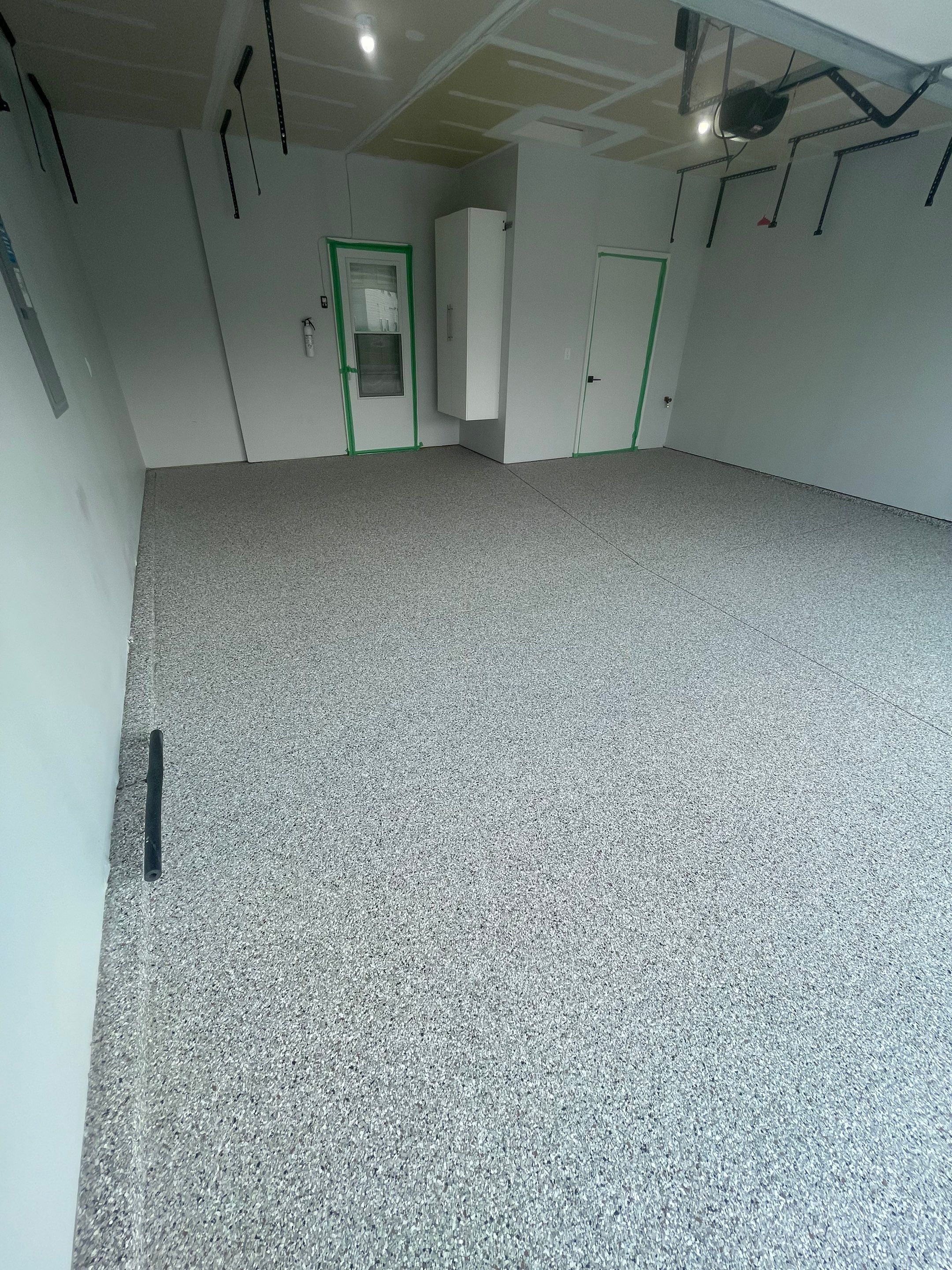 Custom Coyote Flake Garage Floor Coating in Sioux Falls by Select Painting, Coatings & Garage Cabinets