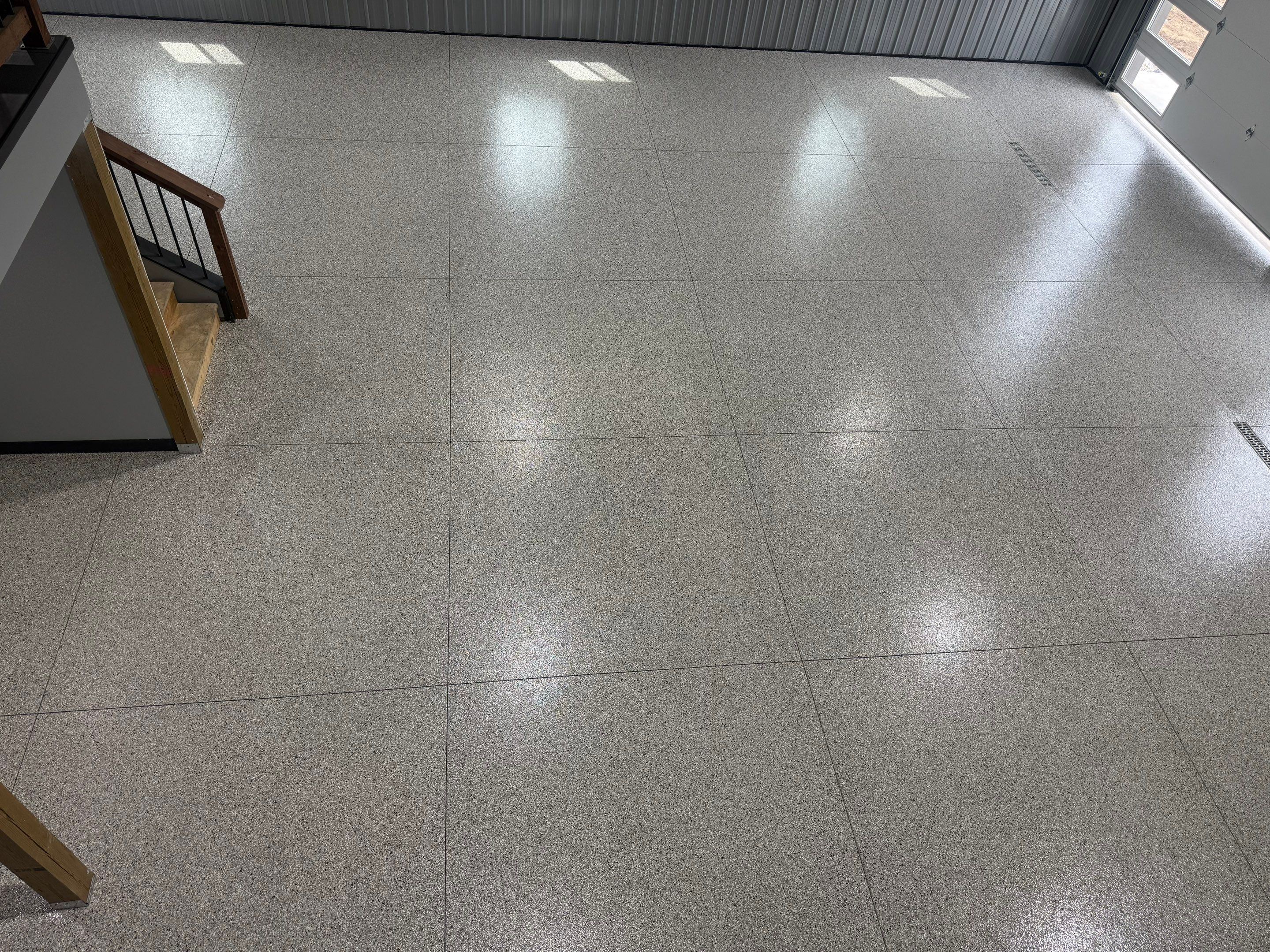 Polyaspartic Garage Floor Coating with Decorative Flake in Wentworth by Select Painting, Coatings & Garage Cabinets