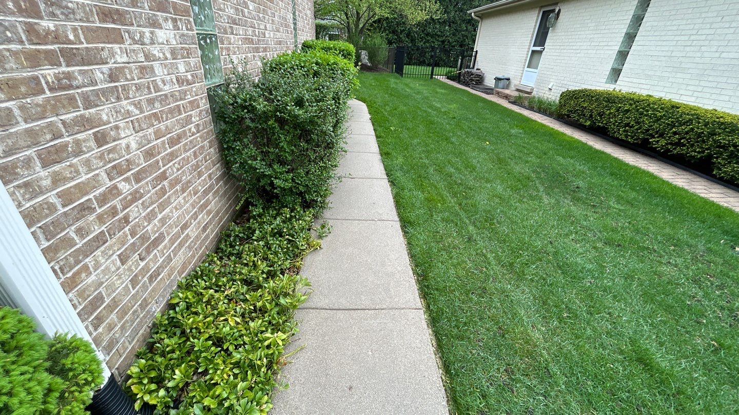 concrete patio and driveway cleaning by Northern Power Washing LLC.