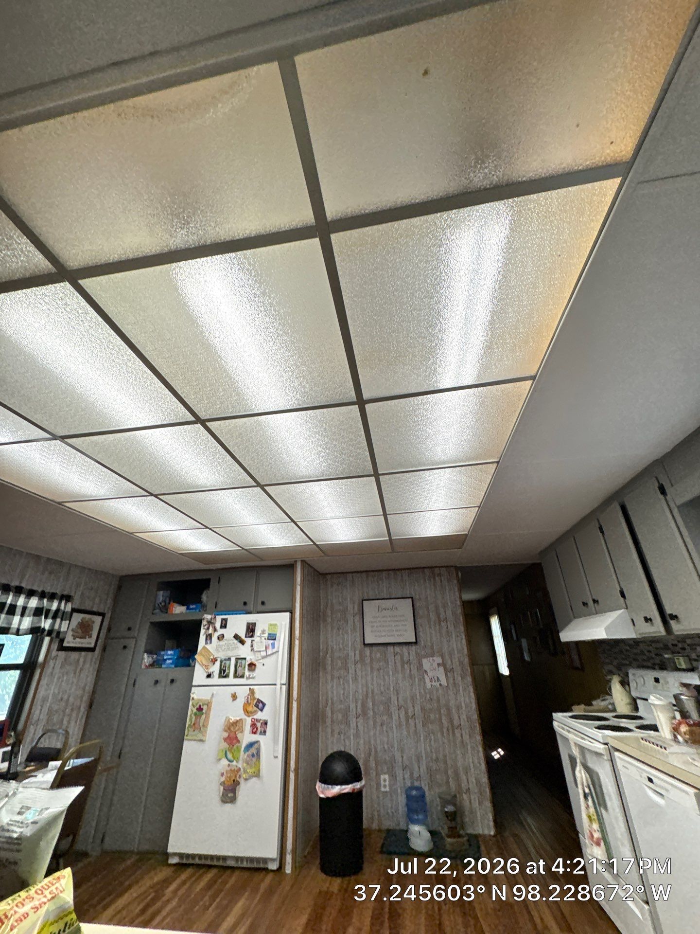 Kitchen Renovation Featuring Grey Cabinetry and Laminate Flooring in Attica by CompanyCam Sales Demo