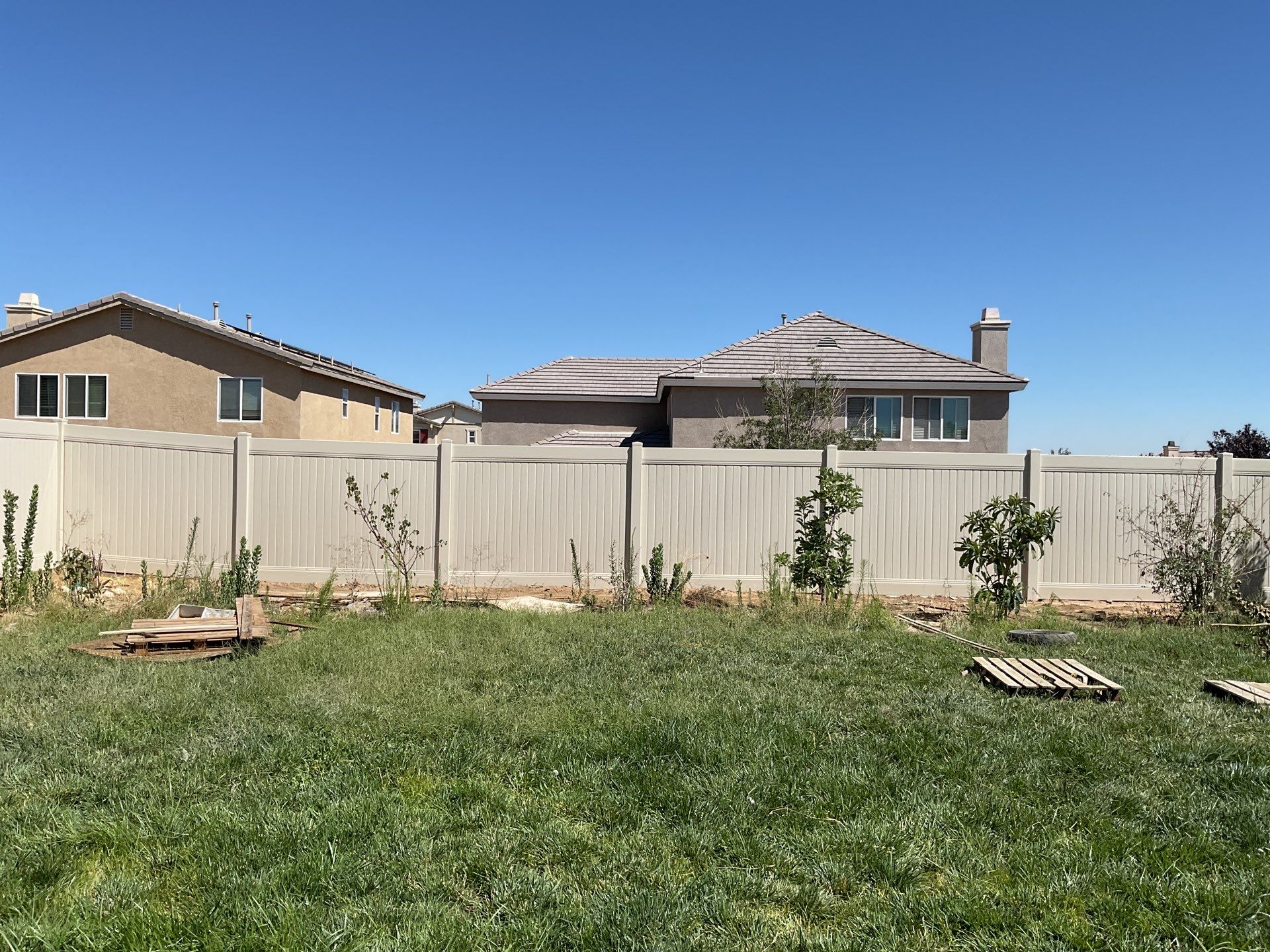 Tan Vinyl by Fence Guys Inc. 