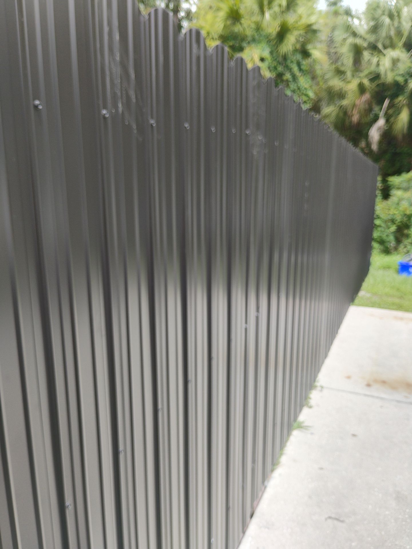 Bronze Scalloped Metal Privacy Fence Installation in North Port by True Fence LLC