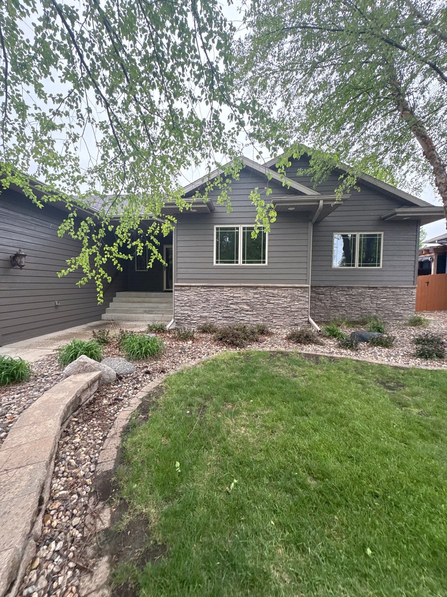 Sioux Falls Residential Exterior Update and Flagstone Pool Deck by Select Painting, Coatings & Garage Cabinets