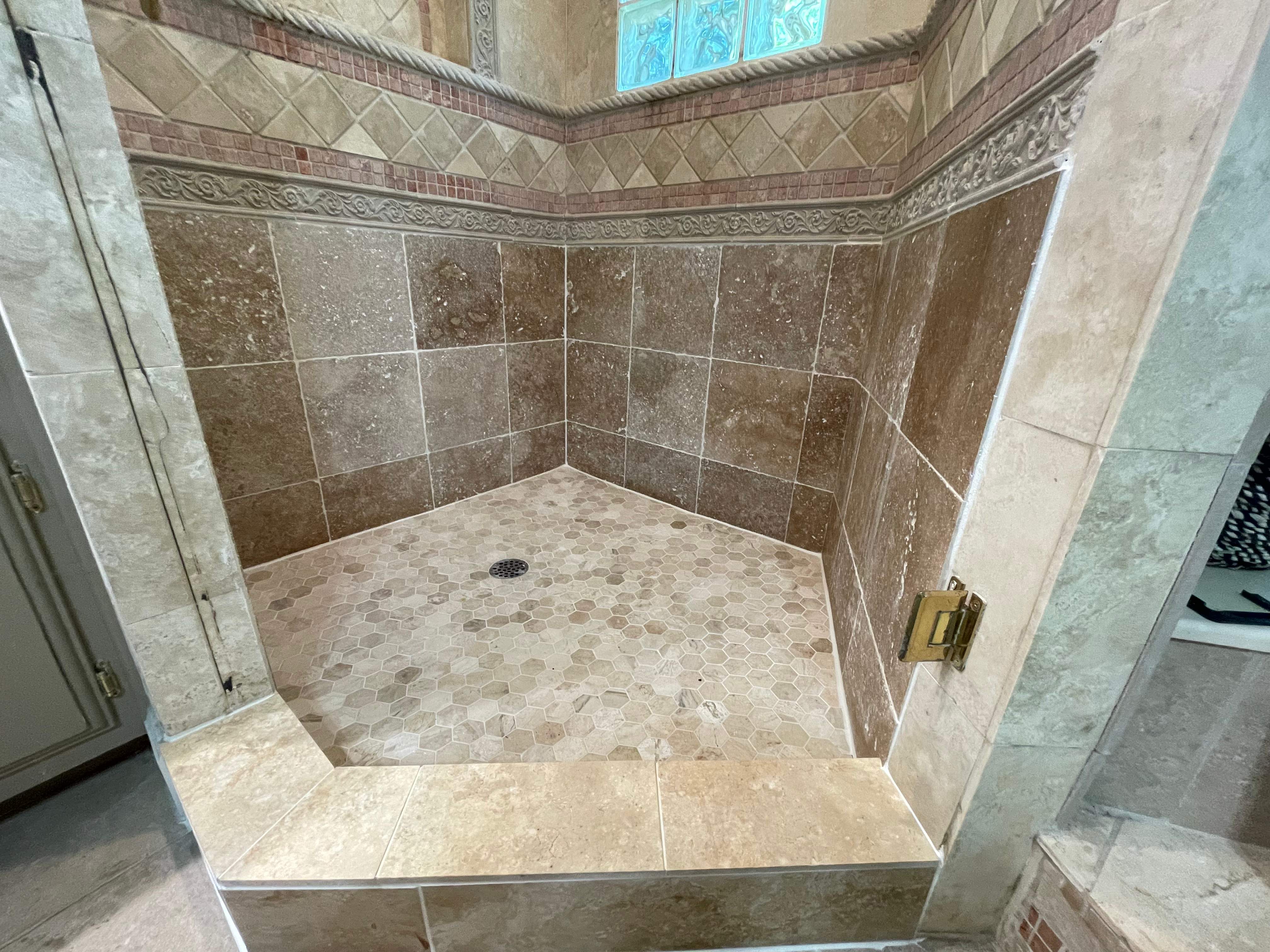 Shower floor repair by Prudencio