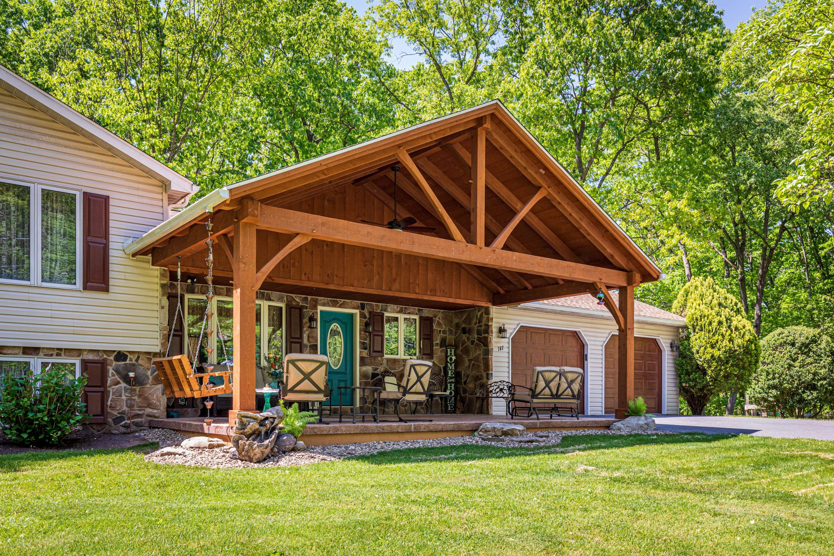 Reshingle-shakewood and timberframe patio roof by Esh Builders