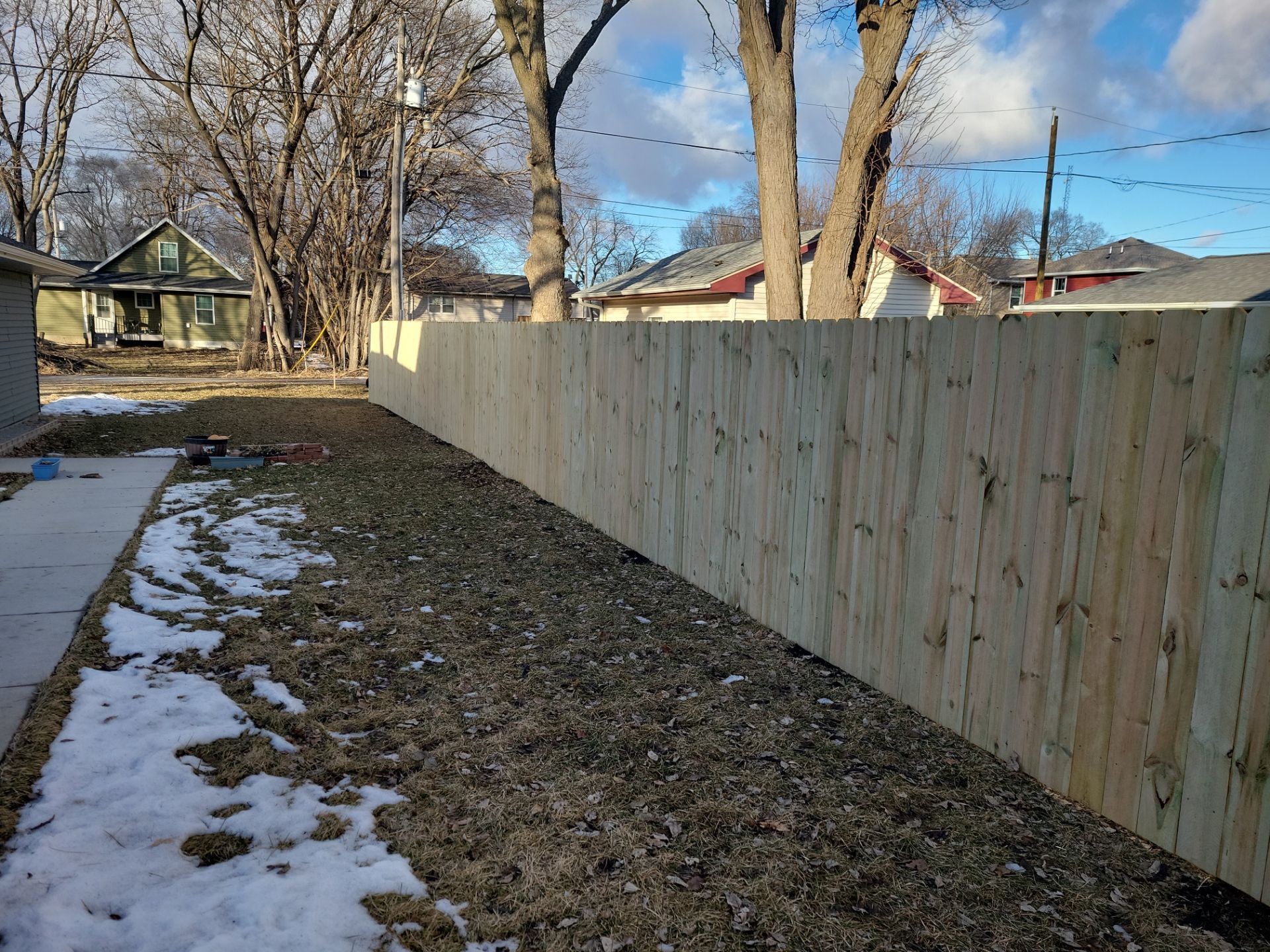 Pressure-Treated Wood Privacy Fence and Double Gate Installation in Waterloo by Perfect Picket Fence and Stain