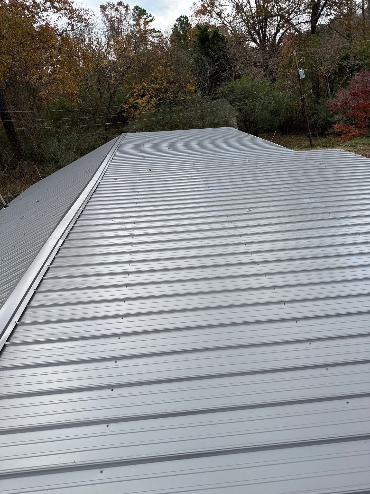 Roof Replacement in Pinson (Metal Roof) by The Roofing Dudes