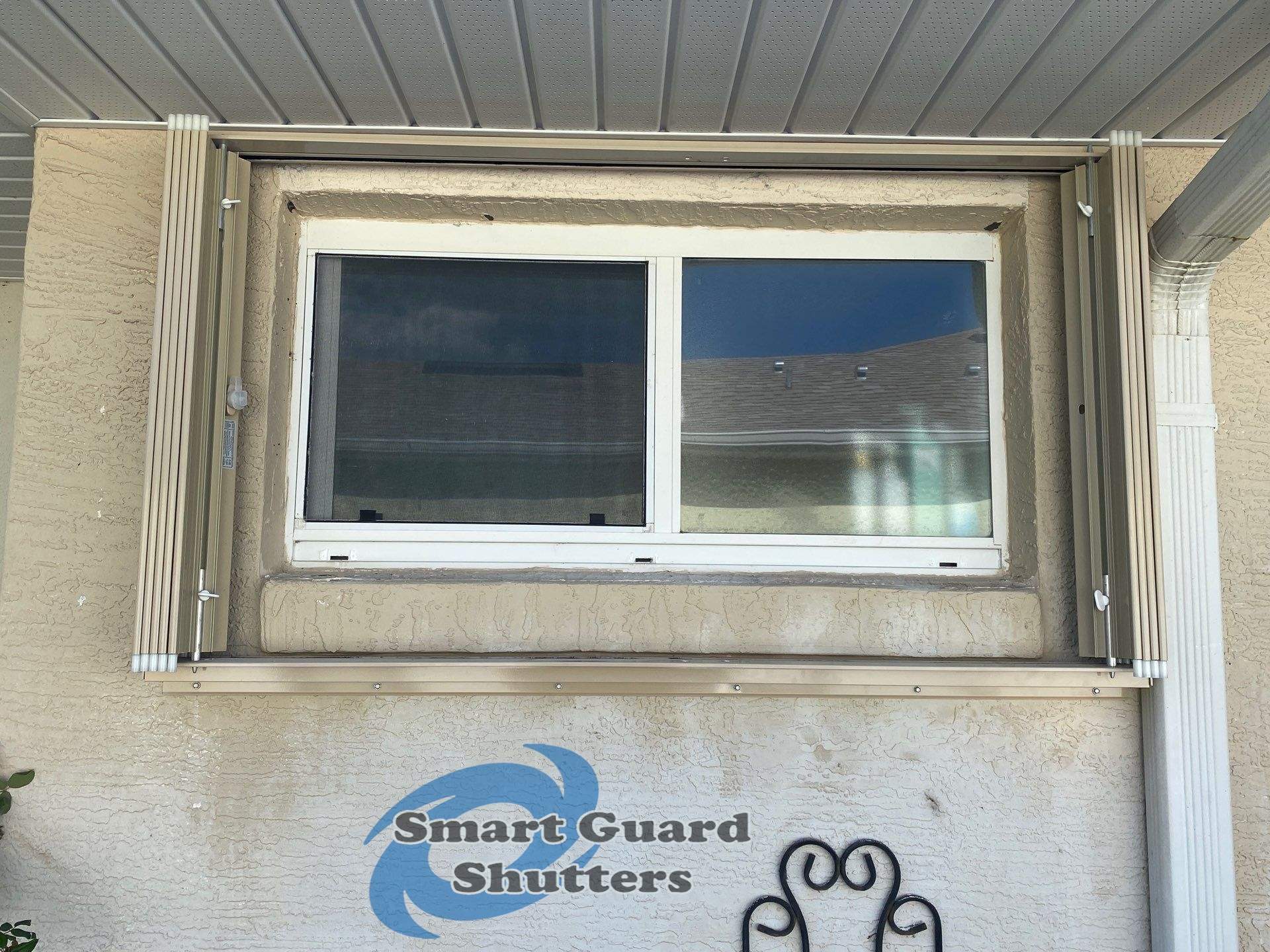 Accordion Shutters in Beige by Smart Guard Shutters