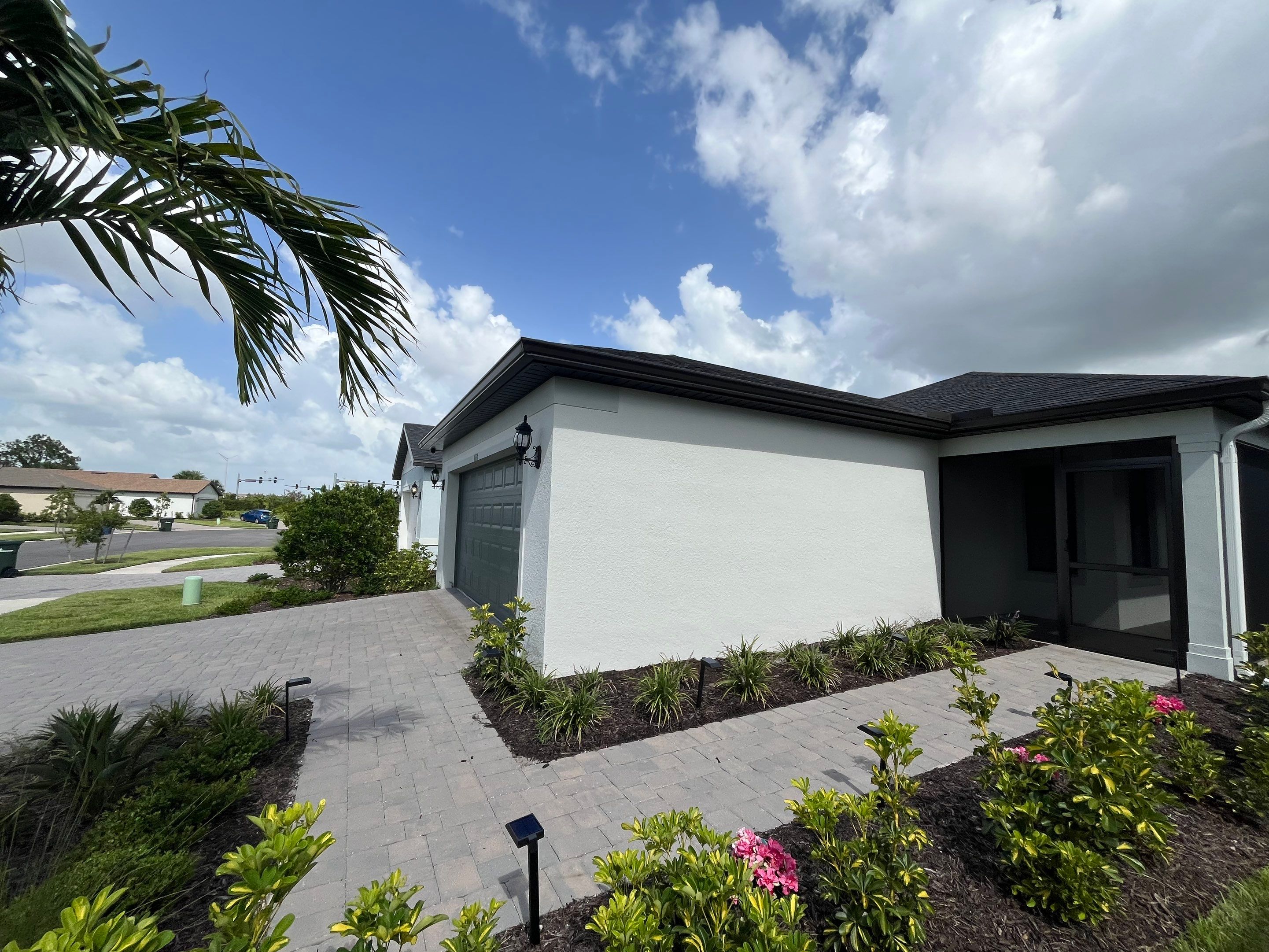 Dark Bronze Gutters and White Downspouts in Sarasota FL by Gutter Professors