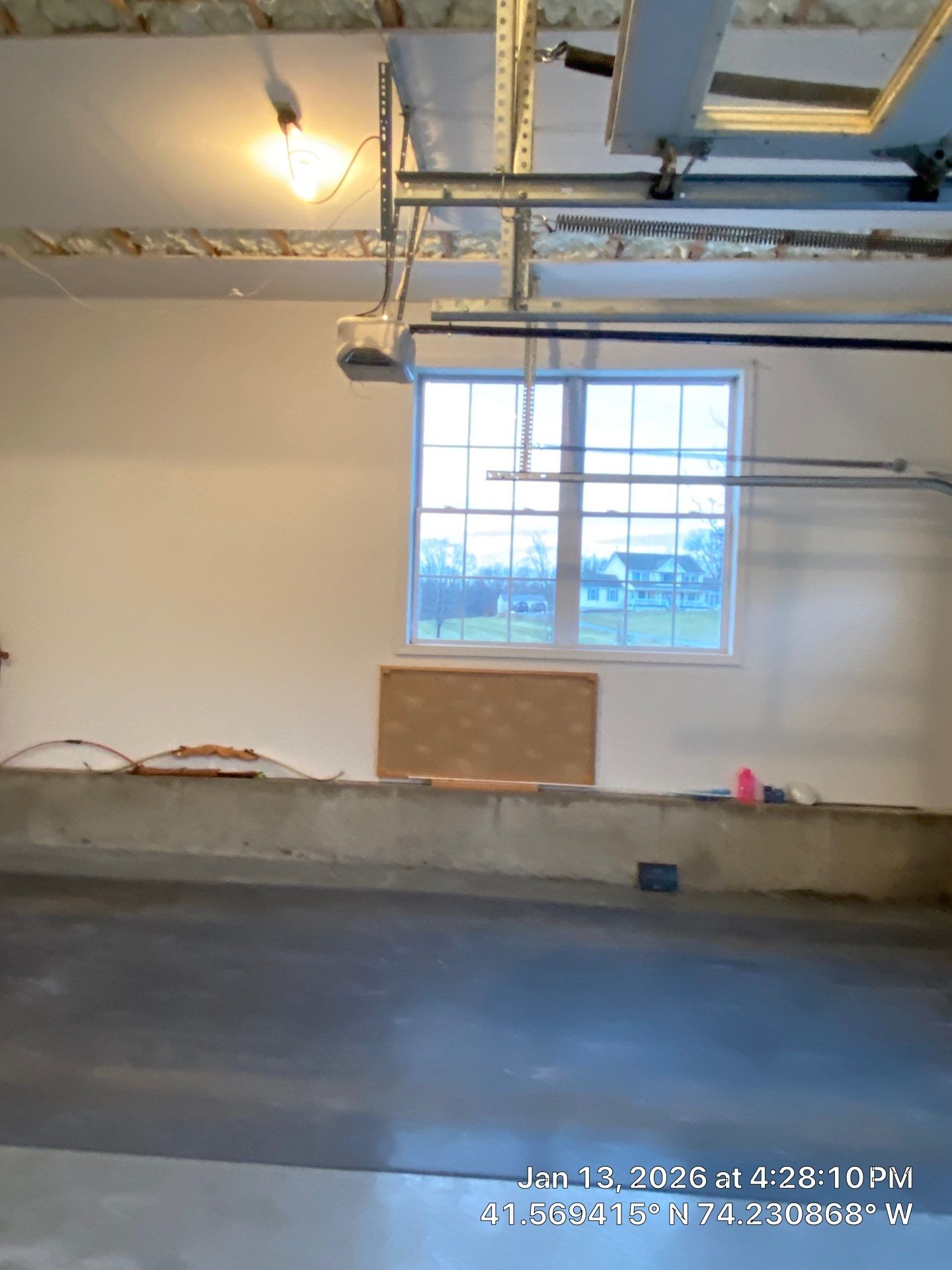 Garage ceiling using open cell spray foam by NYS Foam & Energy