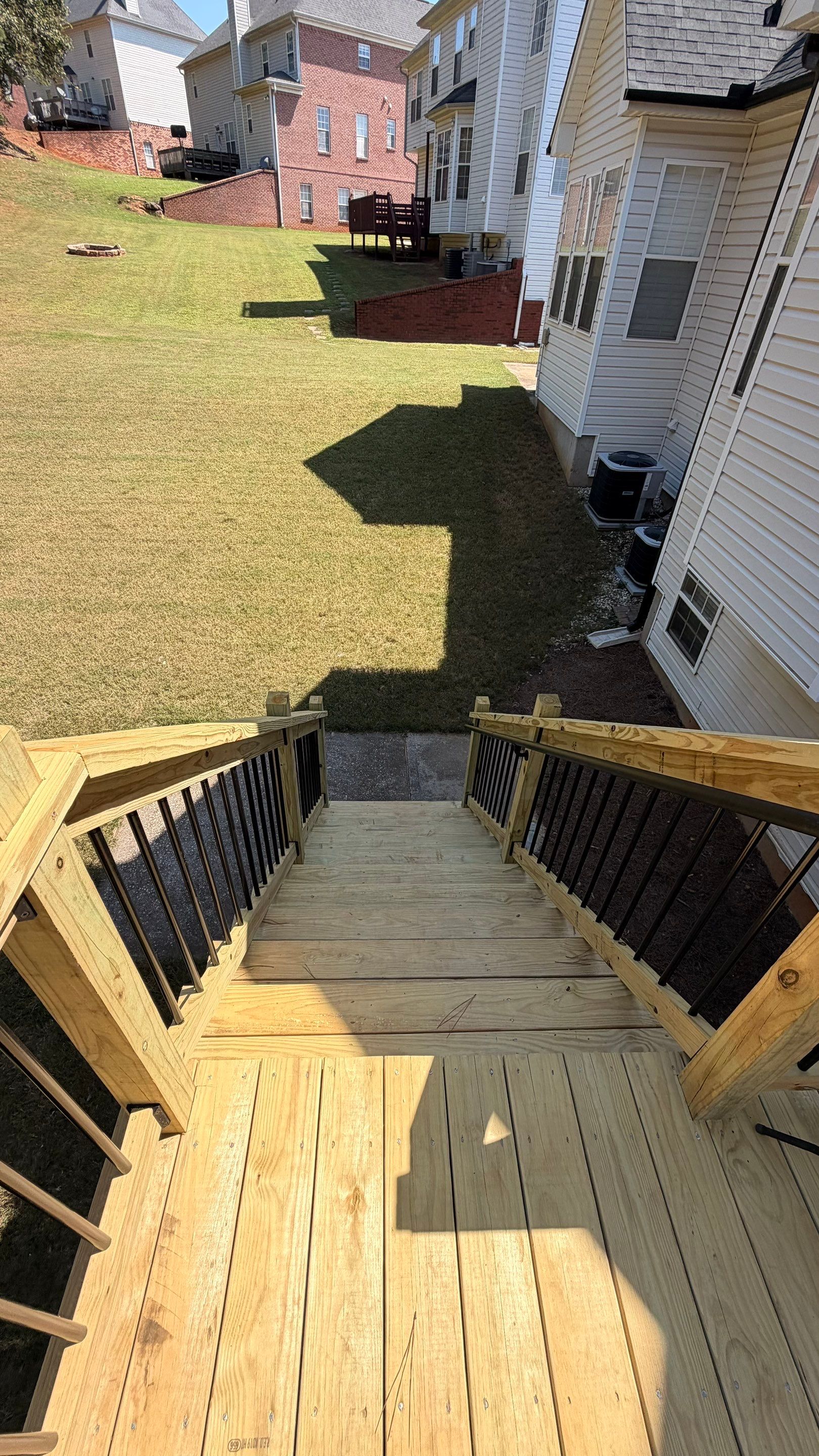 Elevated Pressure-Treated Deck and Staircase Rebuild in Douglasville by Swift Home Renovations