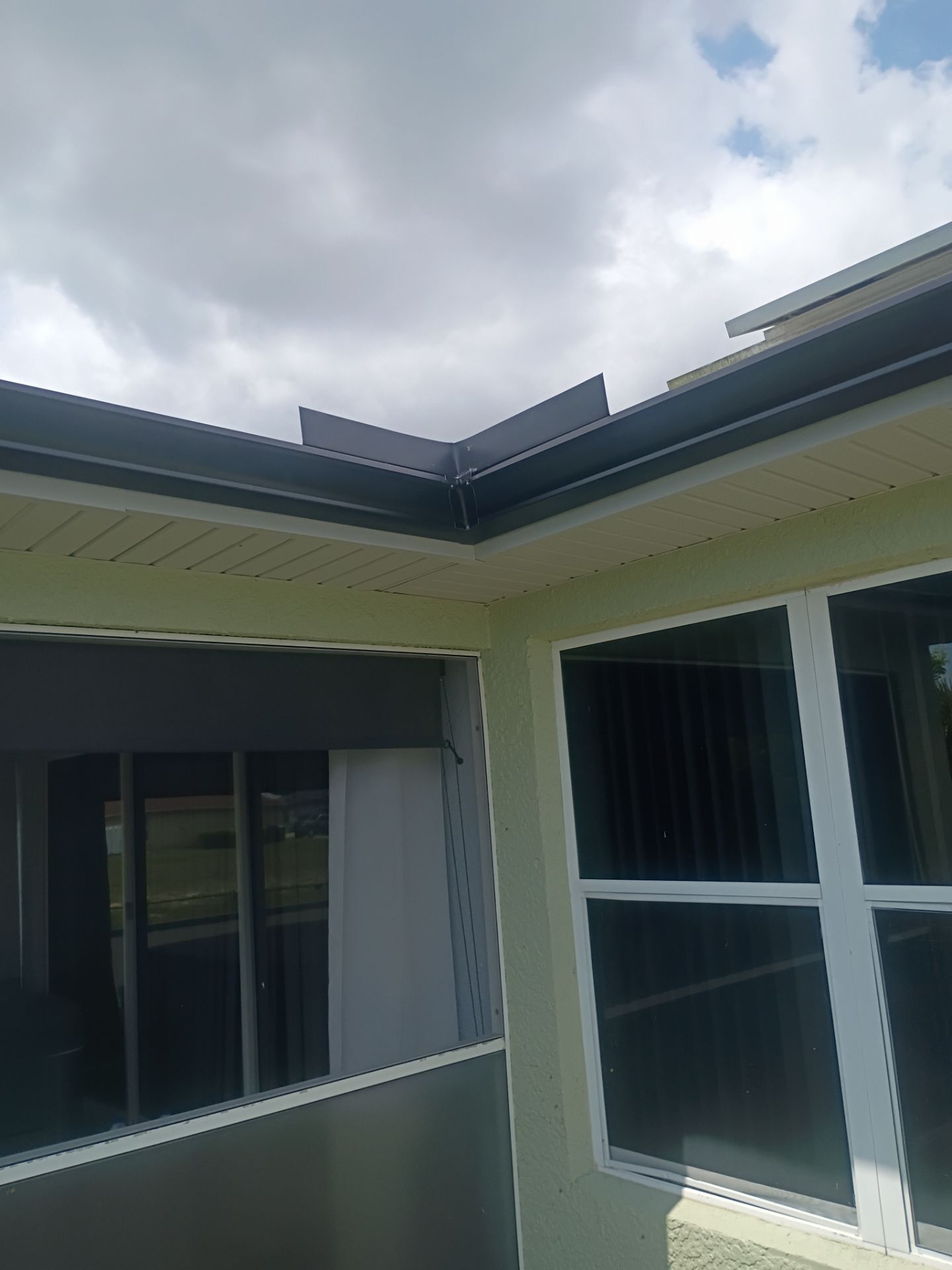 Black Seamless Gutters using K-Style Seamless Gutters in Cape Coral FL by Gutter Professors