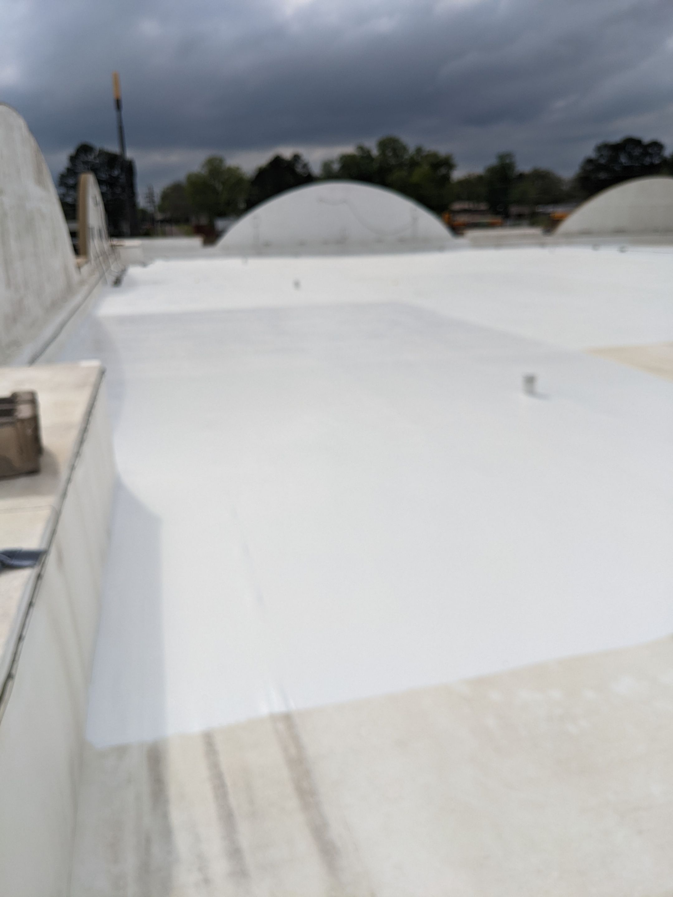 Commercial Roofing Installation using Aldocoat Coatings by Hostetler Roofing