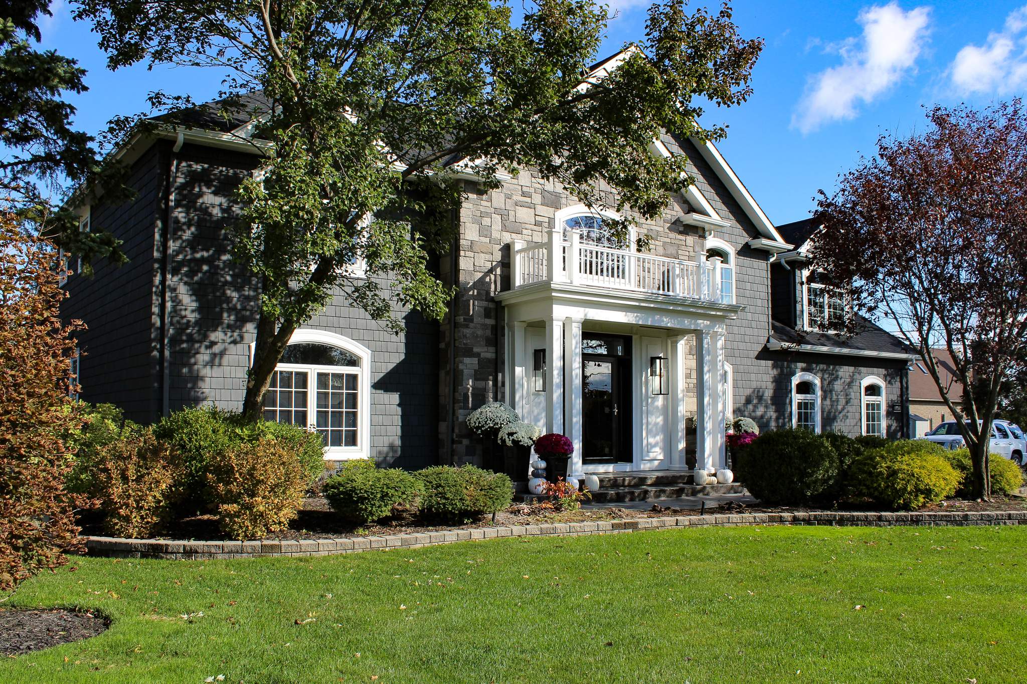 Exterior Renovations- Siding, Concrete, Railings, and Entry Door  by Ivy Lea Construction