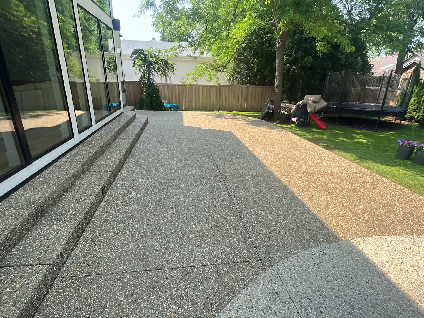 Aggregate concrete cleaning and sealing using Surebond SB-9000 by Northern Power Washing LLC.