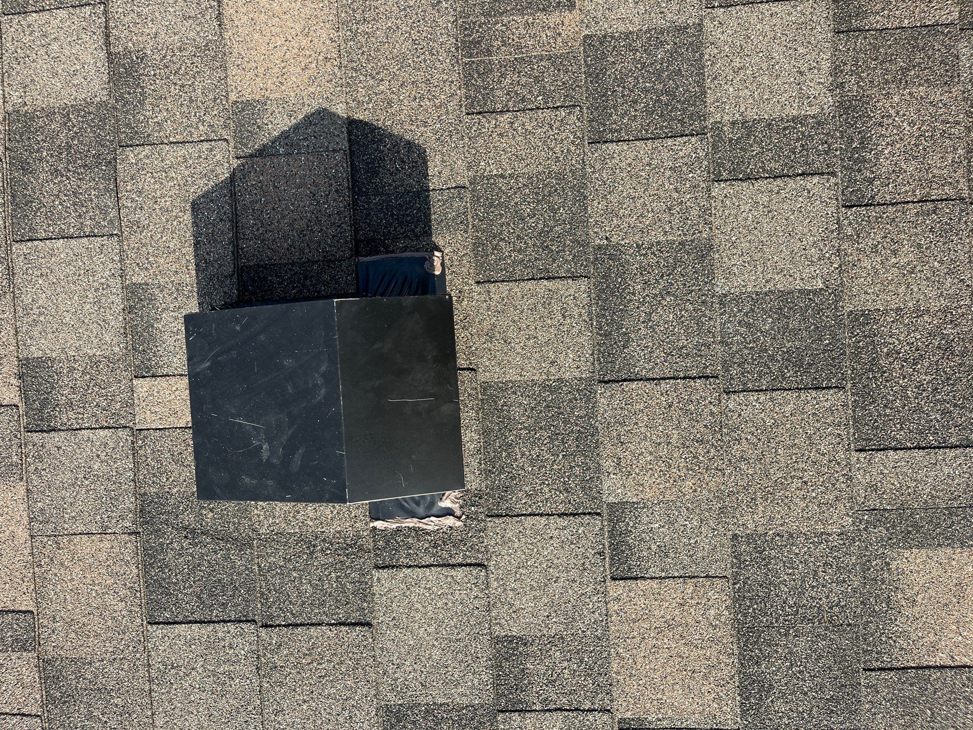 Tan exterior with IKO Driftshake by Tejas Roofworks + Restoration