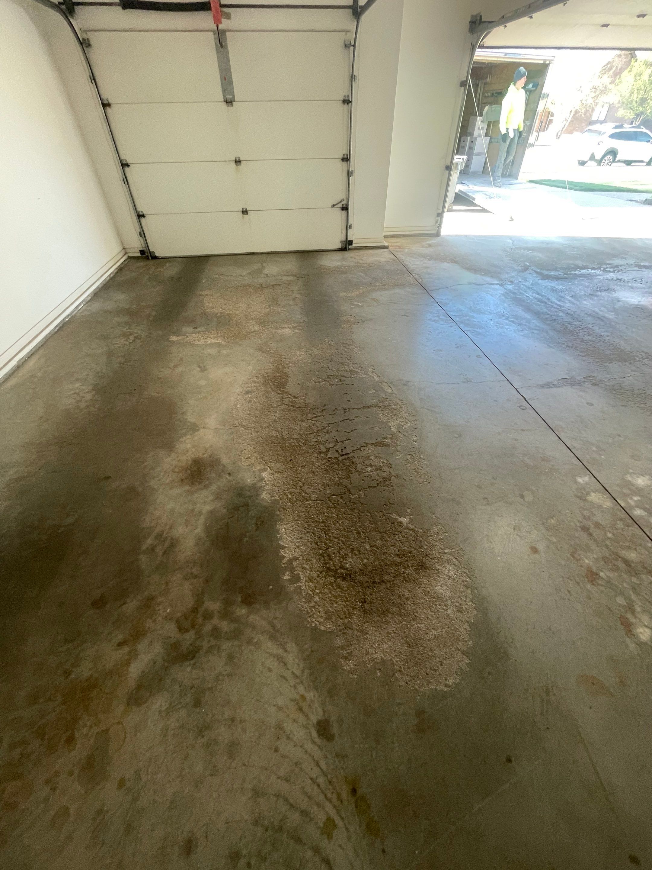 Yankton Garage Floor Restoration with Gray Speckled Epoxy Coating by Select Painting, Coatings & Garage Cabinets