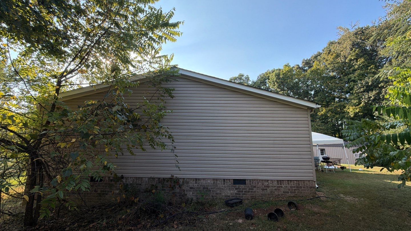 Vinyl Siding and Custom Deck Installation for Lyles Residential Property by Stellar Roofing & Restorations