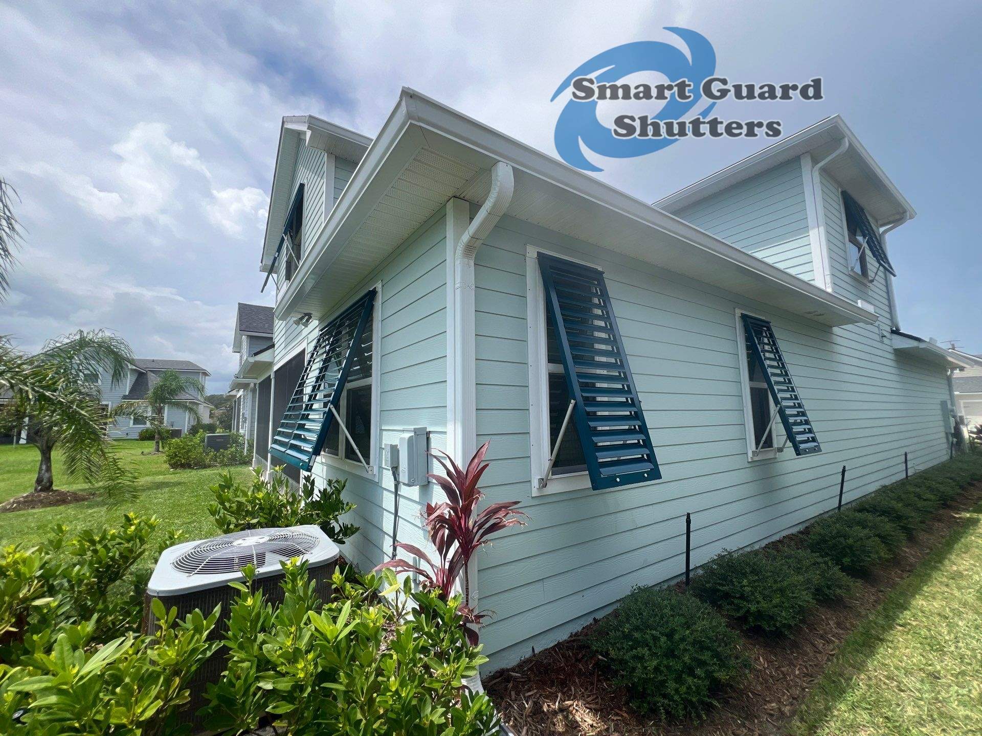 Impact Bahama Shutters in Ocean Blue by Smart Guard Shutters