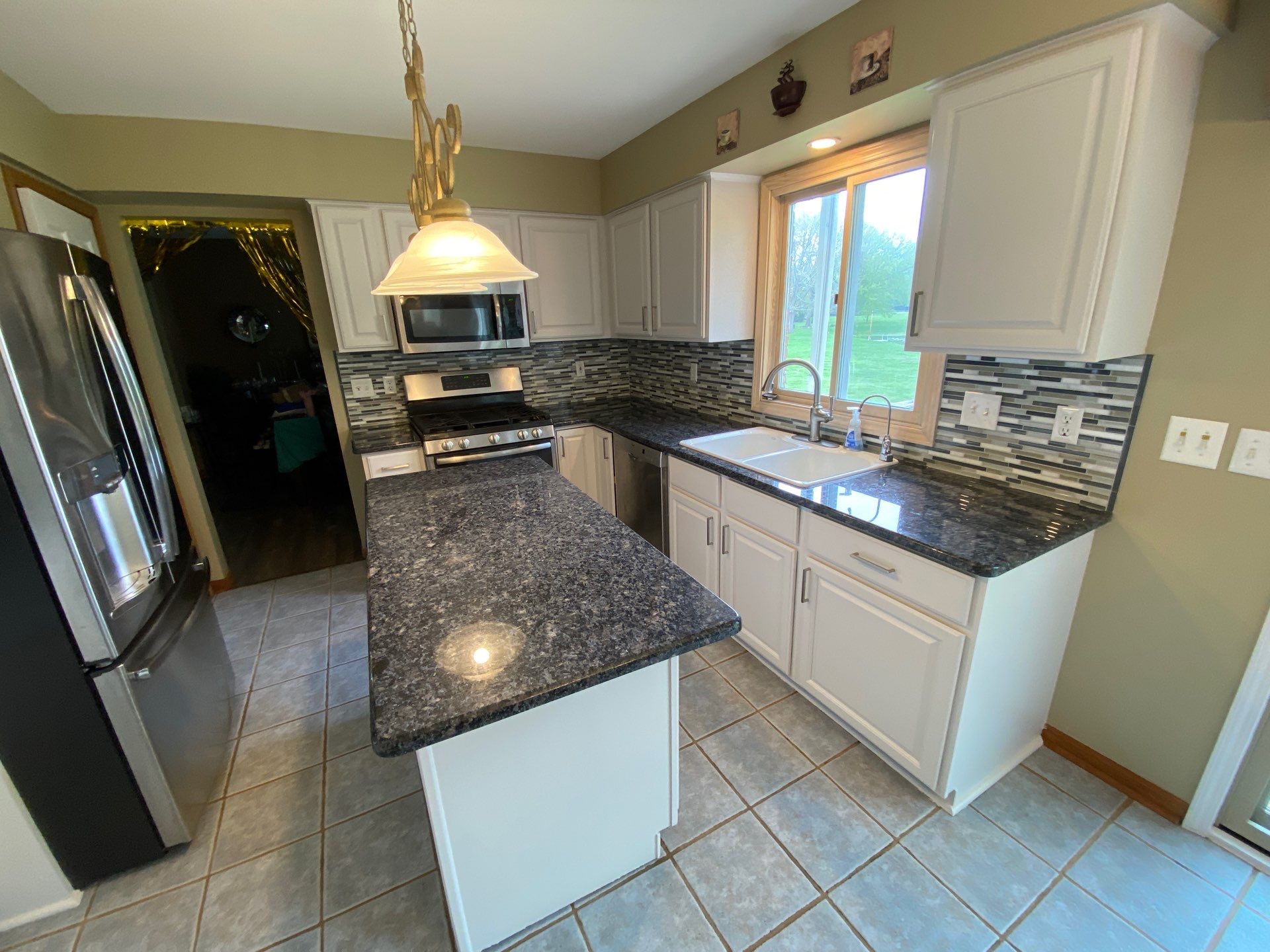 Kitchen Cabinet Refinishing and Hardware Upgrade in White Lake by Top Shelf Painter