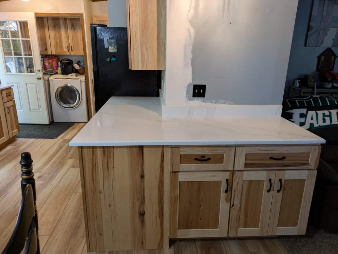 Stunning Kitchen Transformation with Raw Hickory Cabinets by A Step Above Handy LLC 