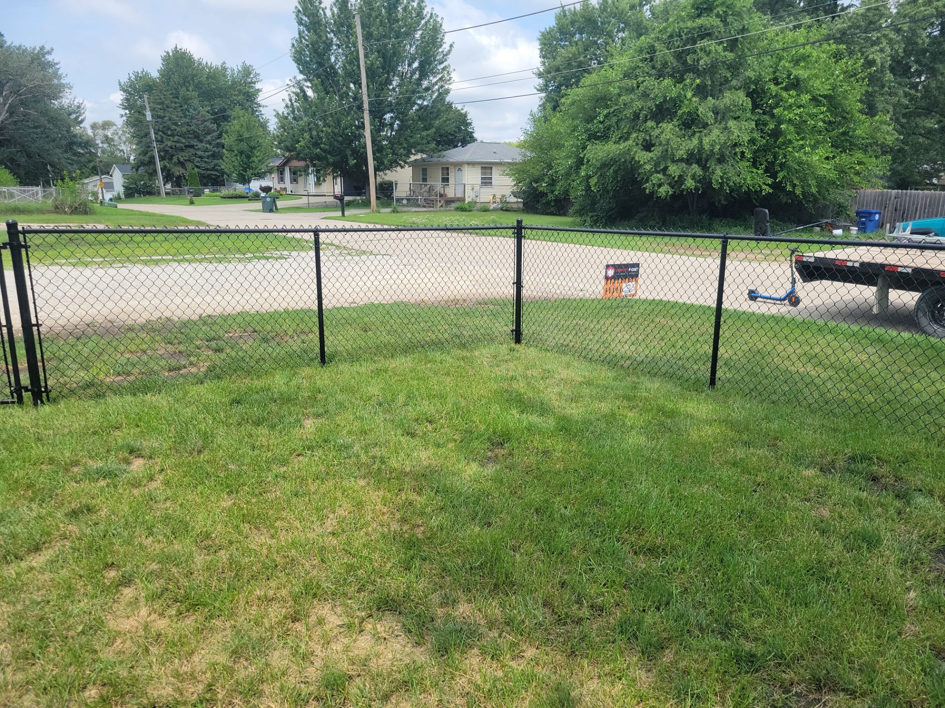 Black Chain Link Perimeter Fence Installation in Waterloo by Perfect Picket Fence and Stain