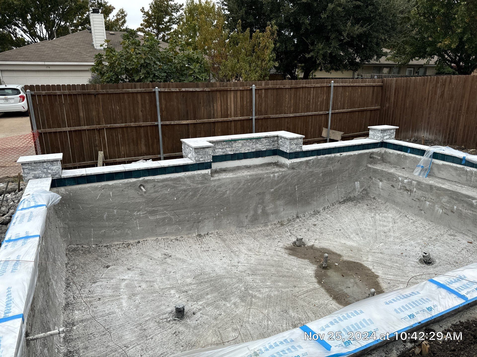 Geometric Pool with Raised Water Feature Wall and Turf by Pinnacle Pools and Spas - DFW